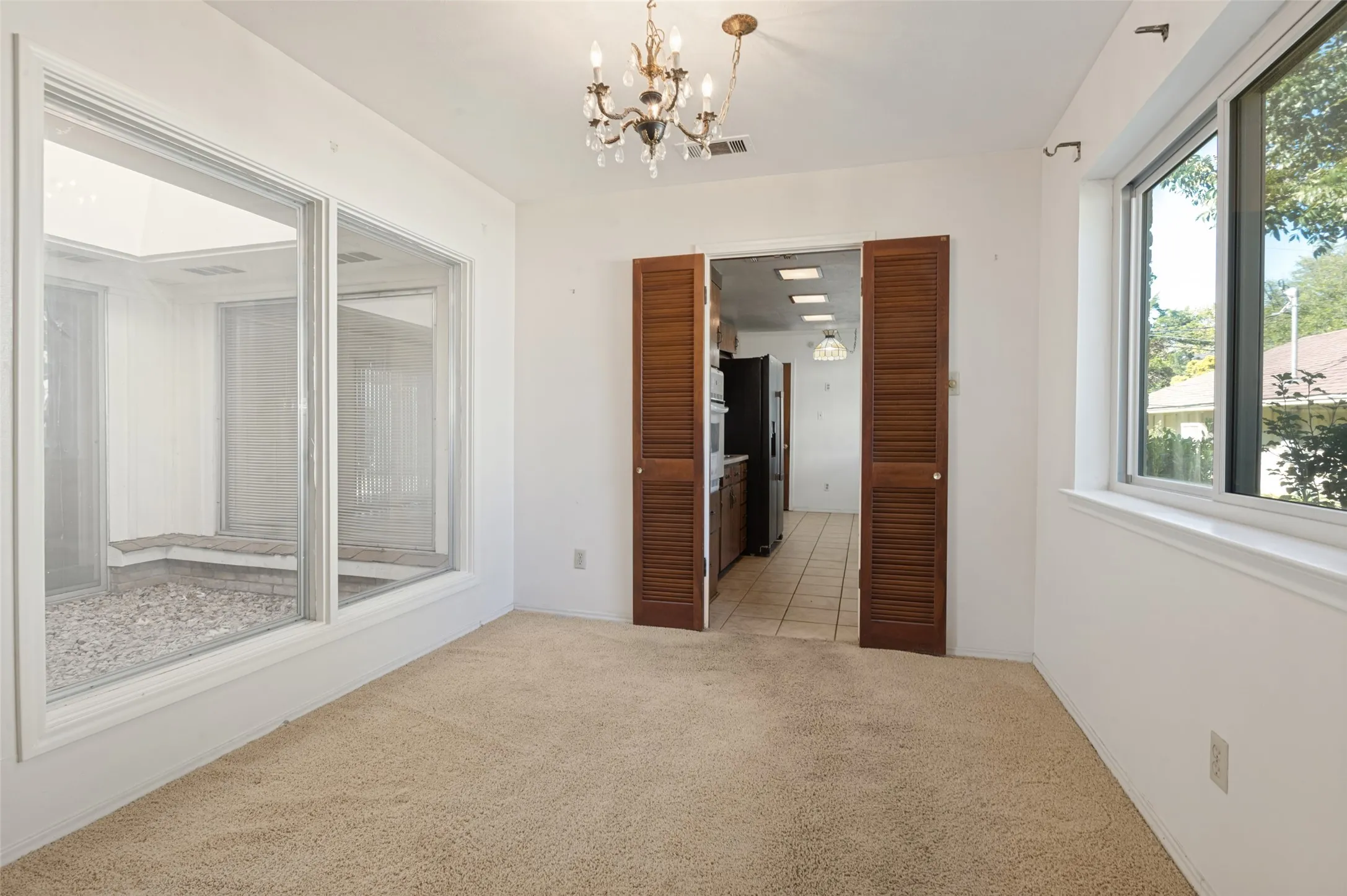 White walls and light-toned carpet