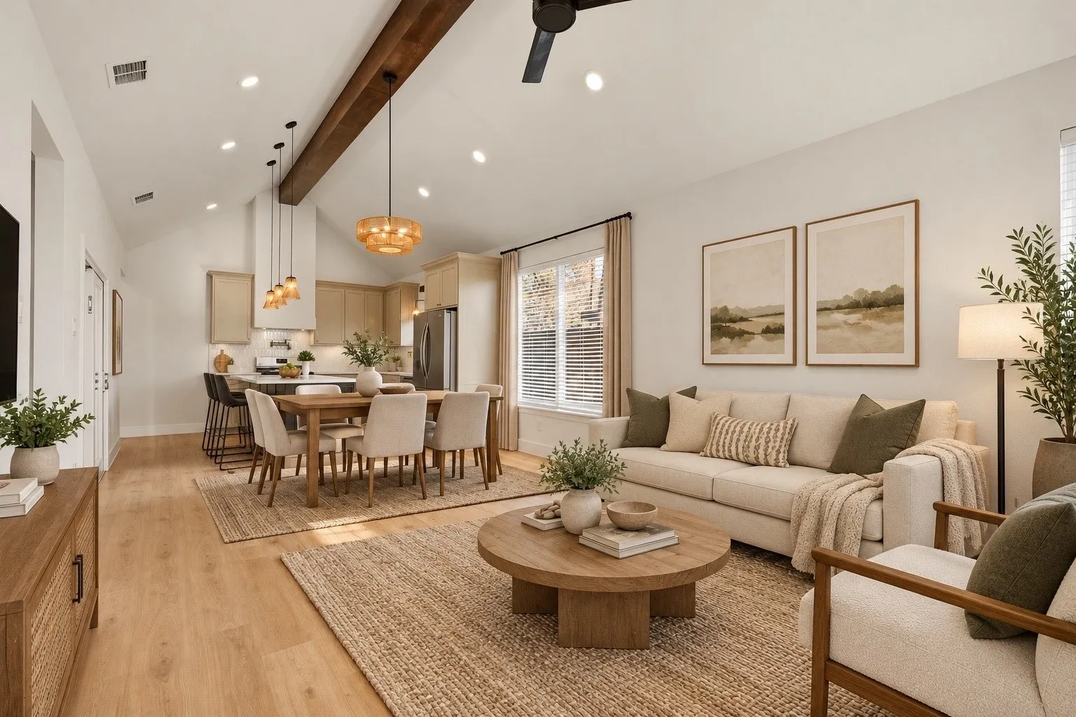 Virtually Staged:Open-concept living area with vaulted ceilings, exposed wood beam, recessed lighting, and wood-finish flooring