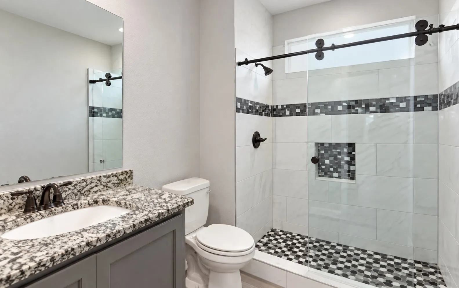 Walk-in shower with clear glass enclosure