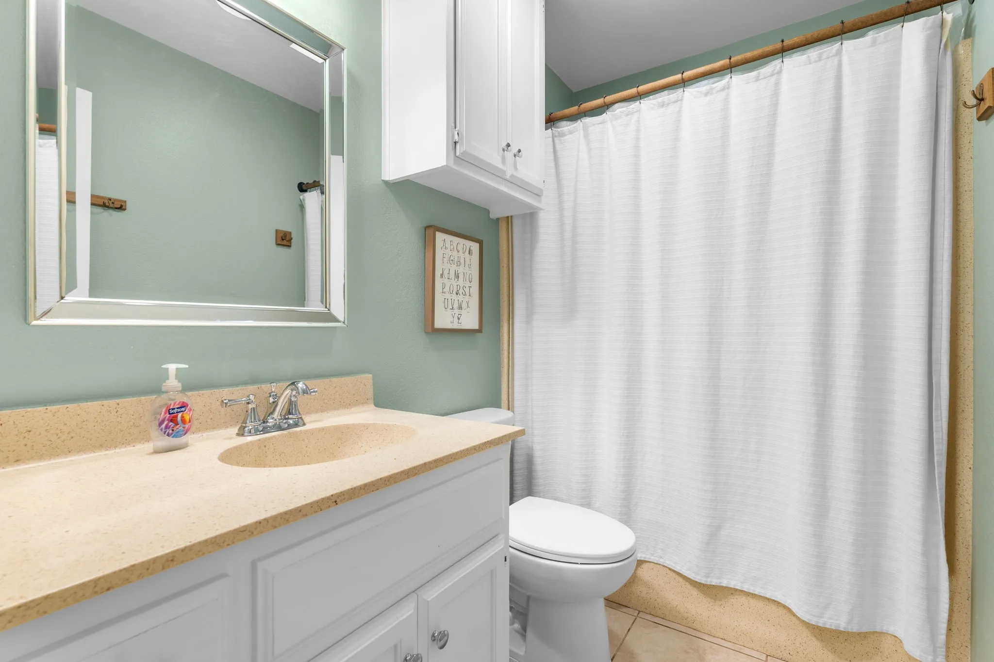 Vanity with integrated sink and chrome faucet