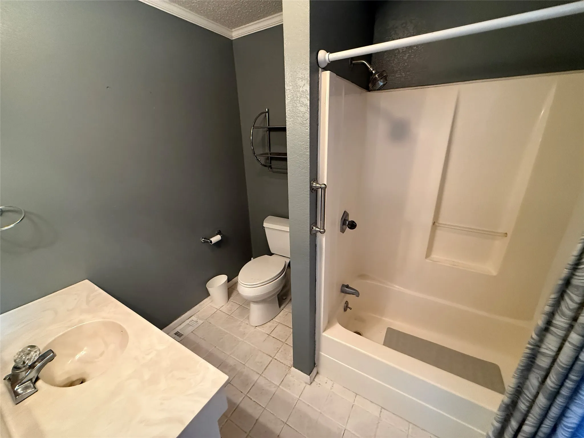Vanity with integrated sink, toilet, and a shower-tub combination unit