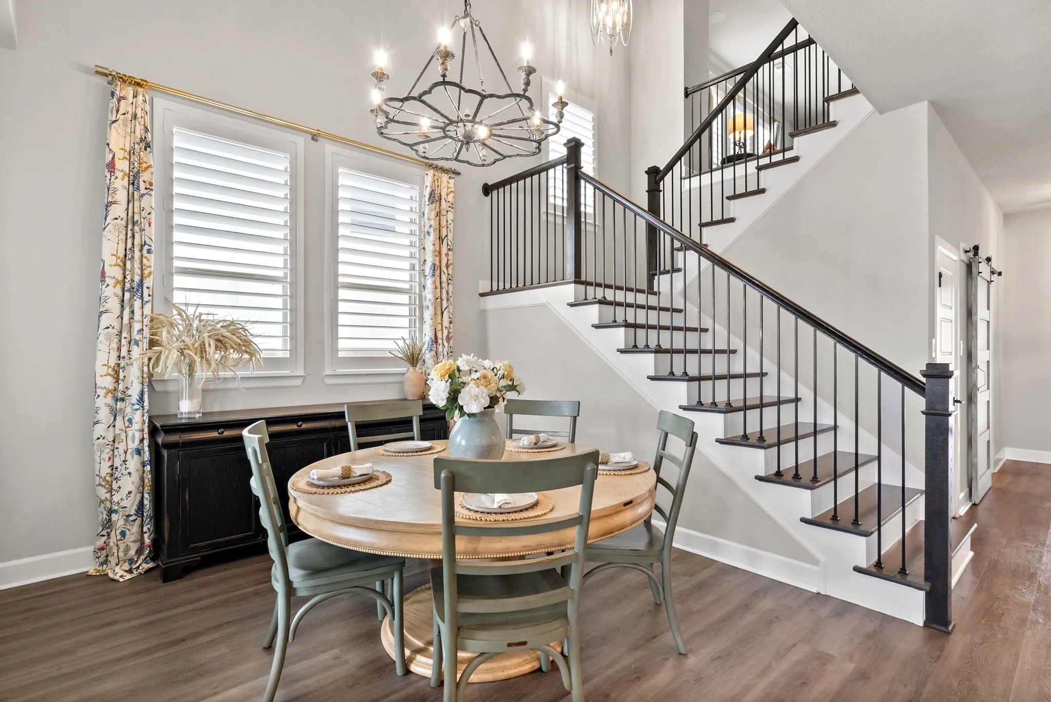 Open-concept living space with wood-finish flooring