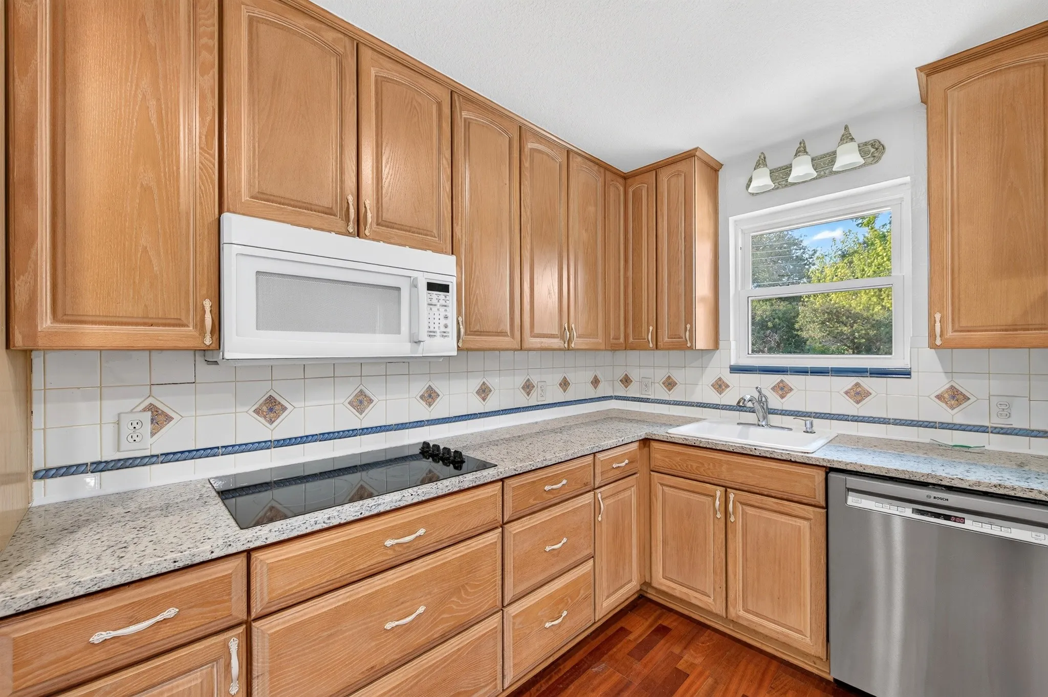 Wood-finish cabinetry with abundant storage