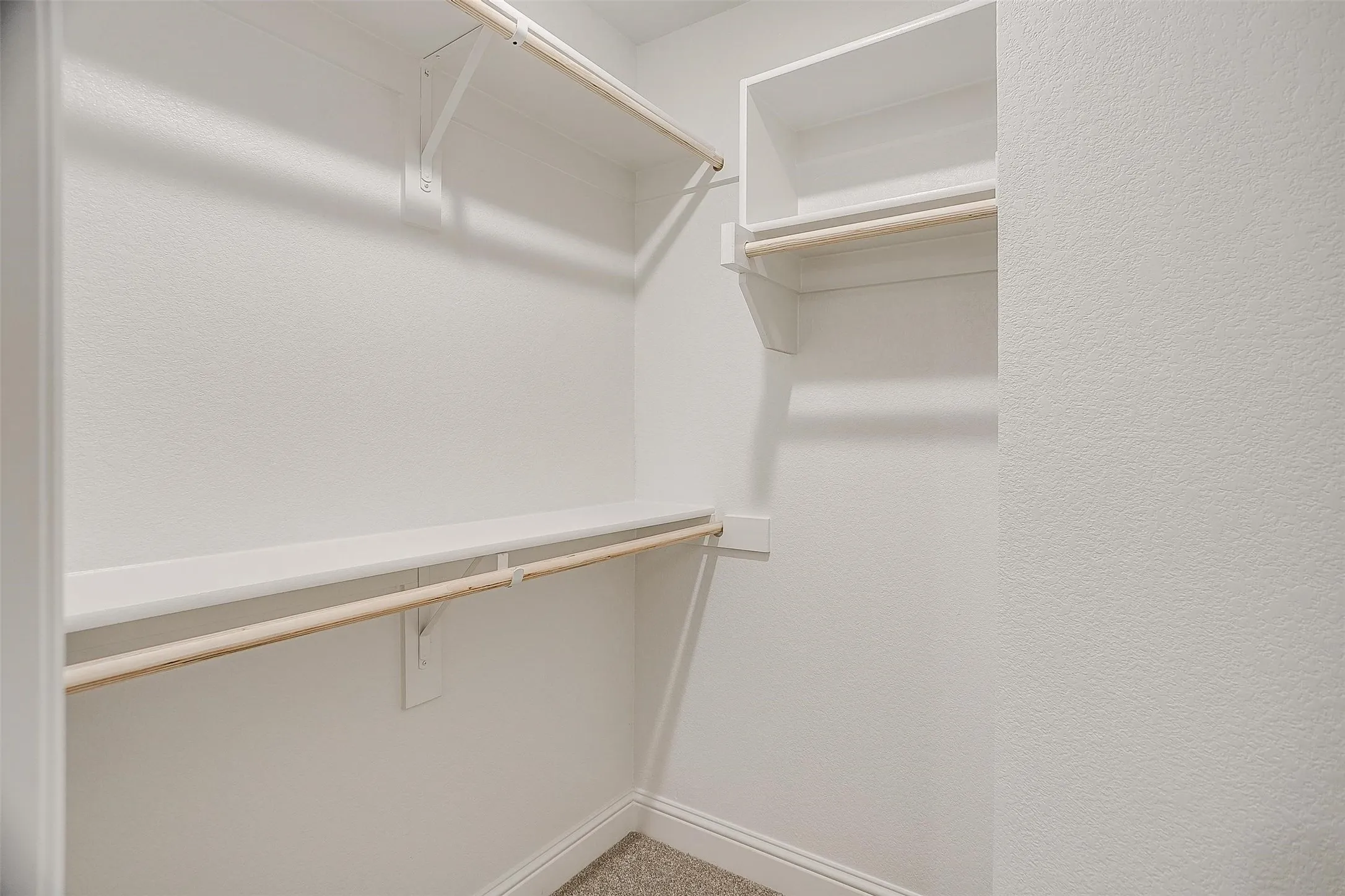 Built-in closet shelving system with hanging rods
