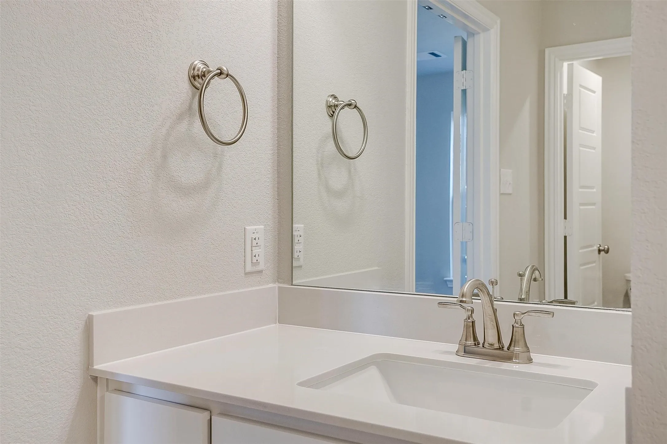 White countertop with an integrated rectangular sink