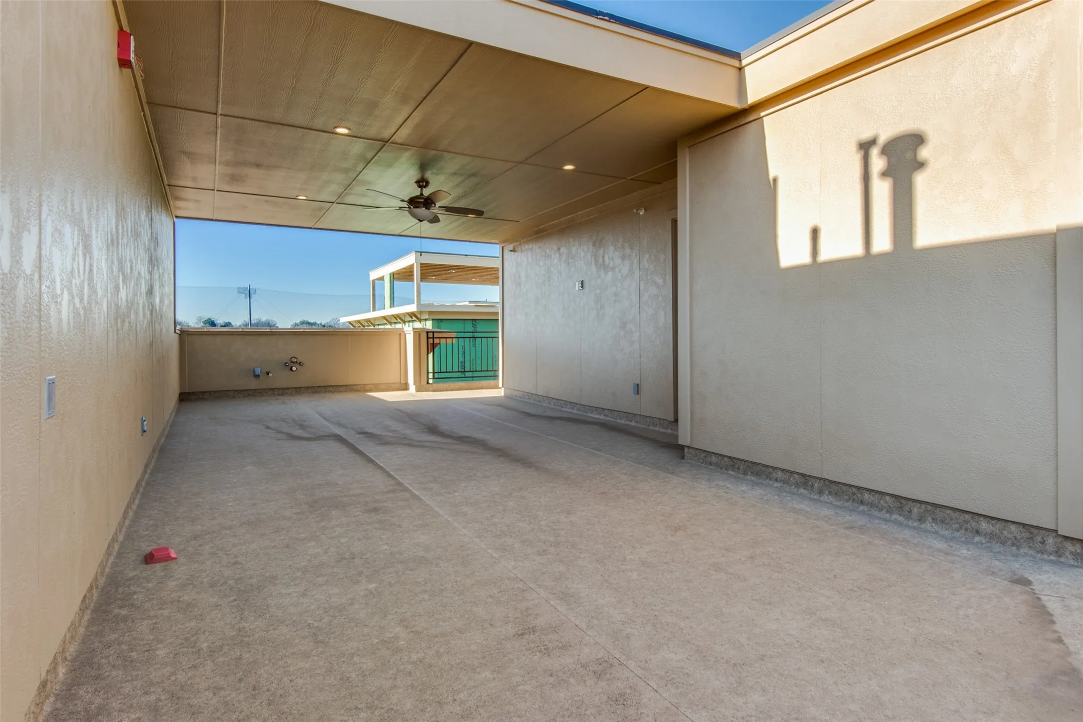 Perially covered rooftop deck