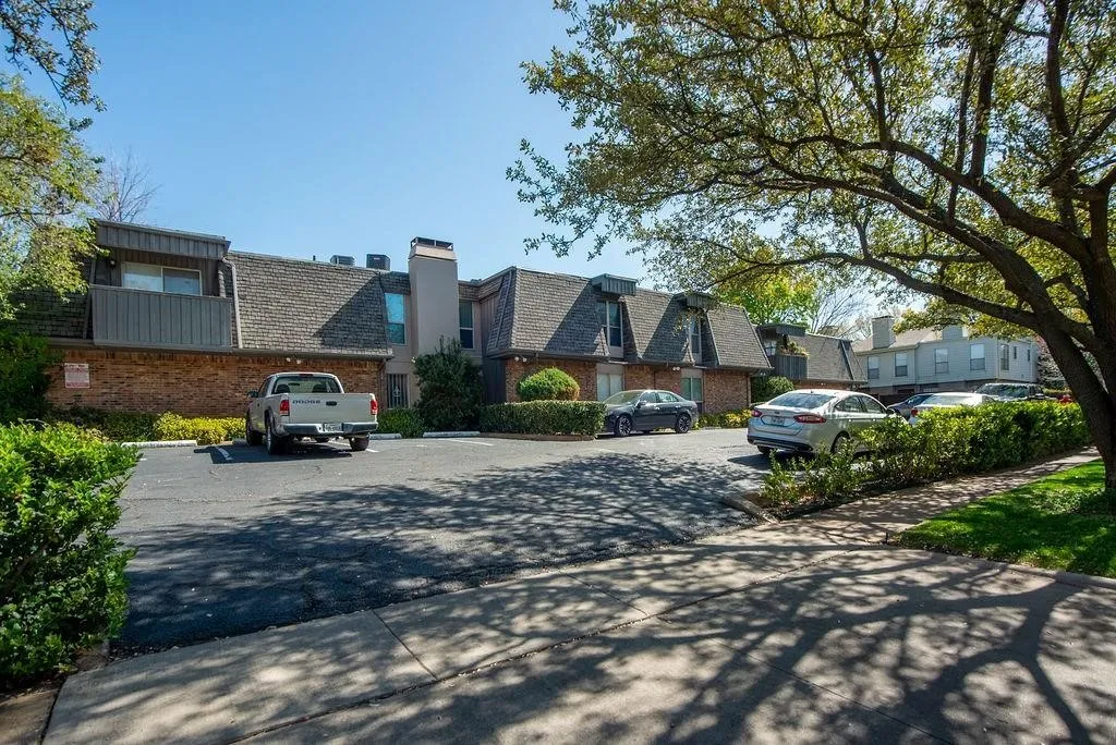 Brick and siding exterior with pitched shingle roofs