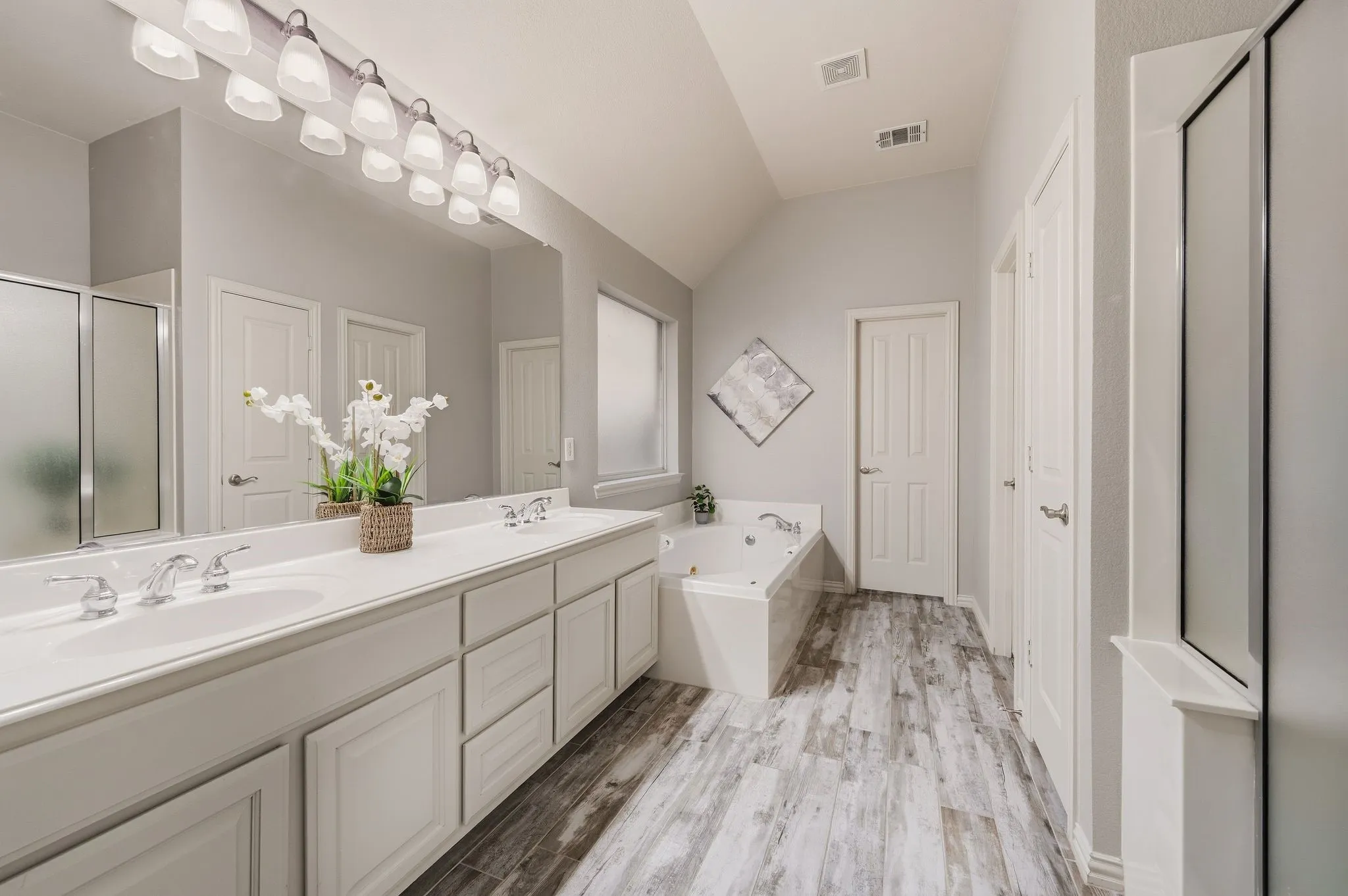 Dual vanity with undermount sinks and chrome fixtures