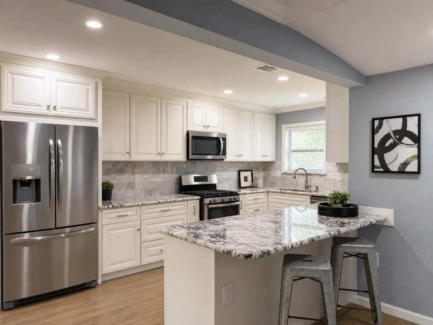 Kitchen featuring white cabinetry, stainless steel appliances, granite countertops, tile backsplash, and wood-finish flooring