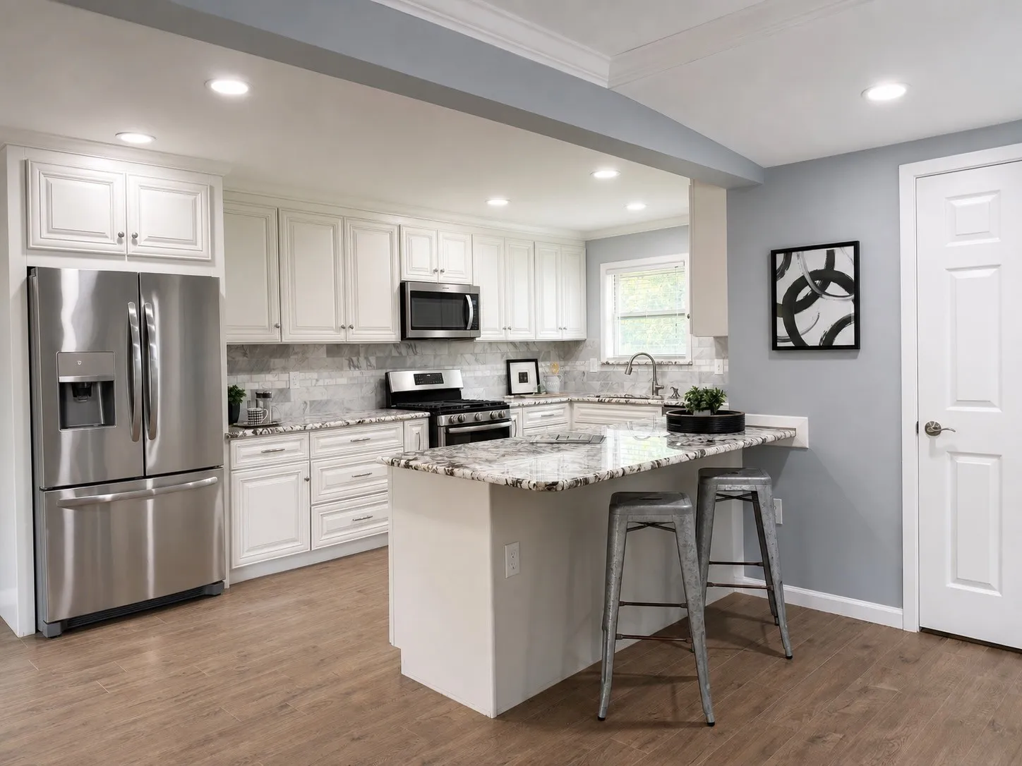 White cabinetry with stainless steel appliances, granite countertops, and a tile backsplash