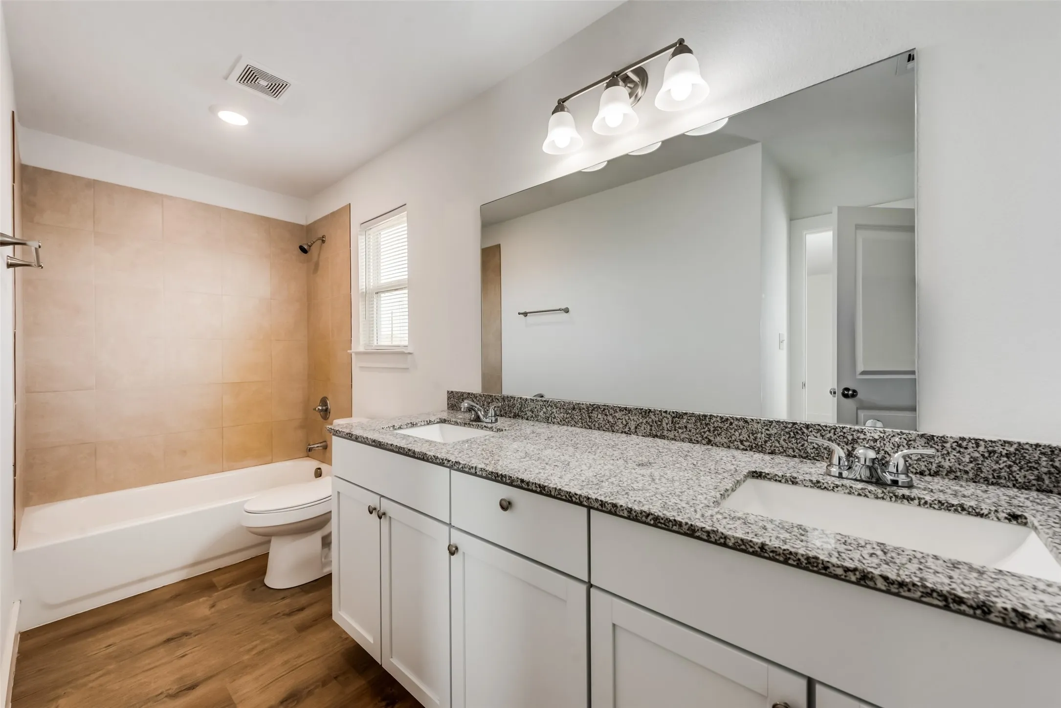 Dual vanity with stone-finish countertop and undermount sinks