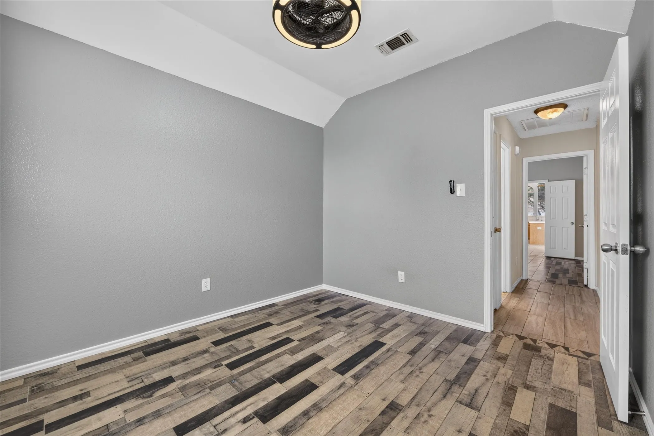Vaulted ceiling with a flush-mount ceiling light