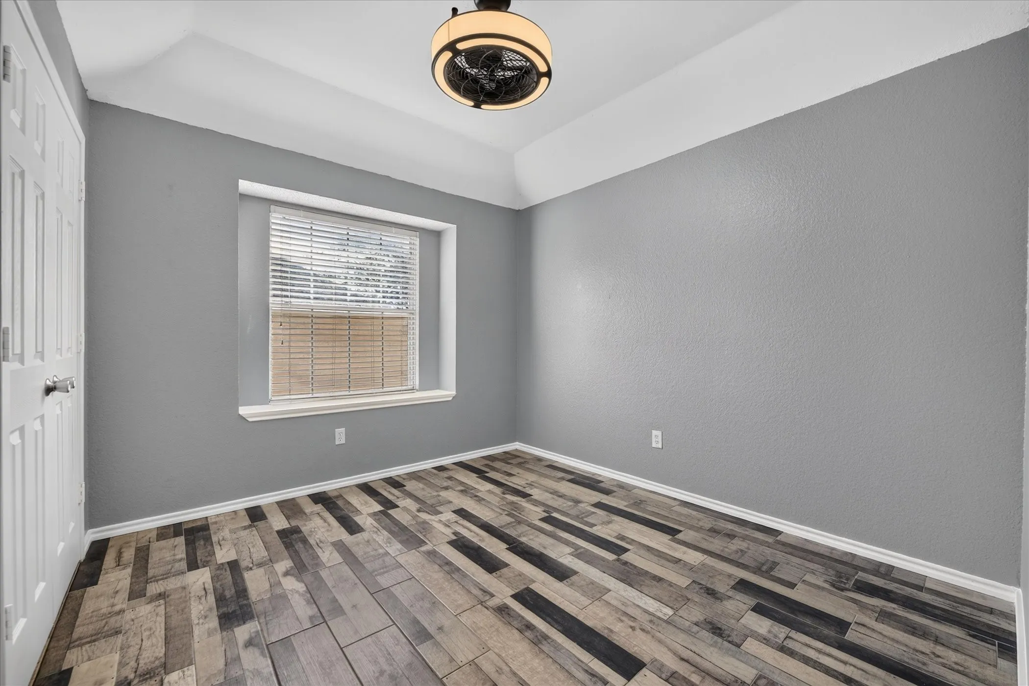 Tray ceiling with a modern flush-mount light fixture