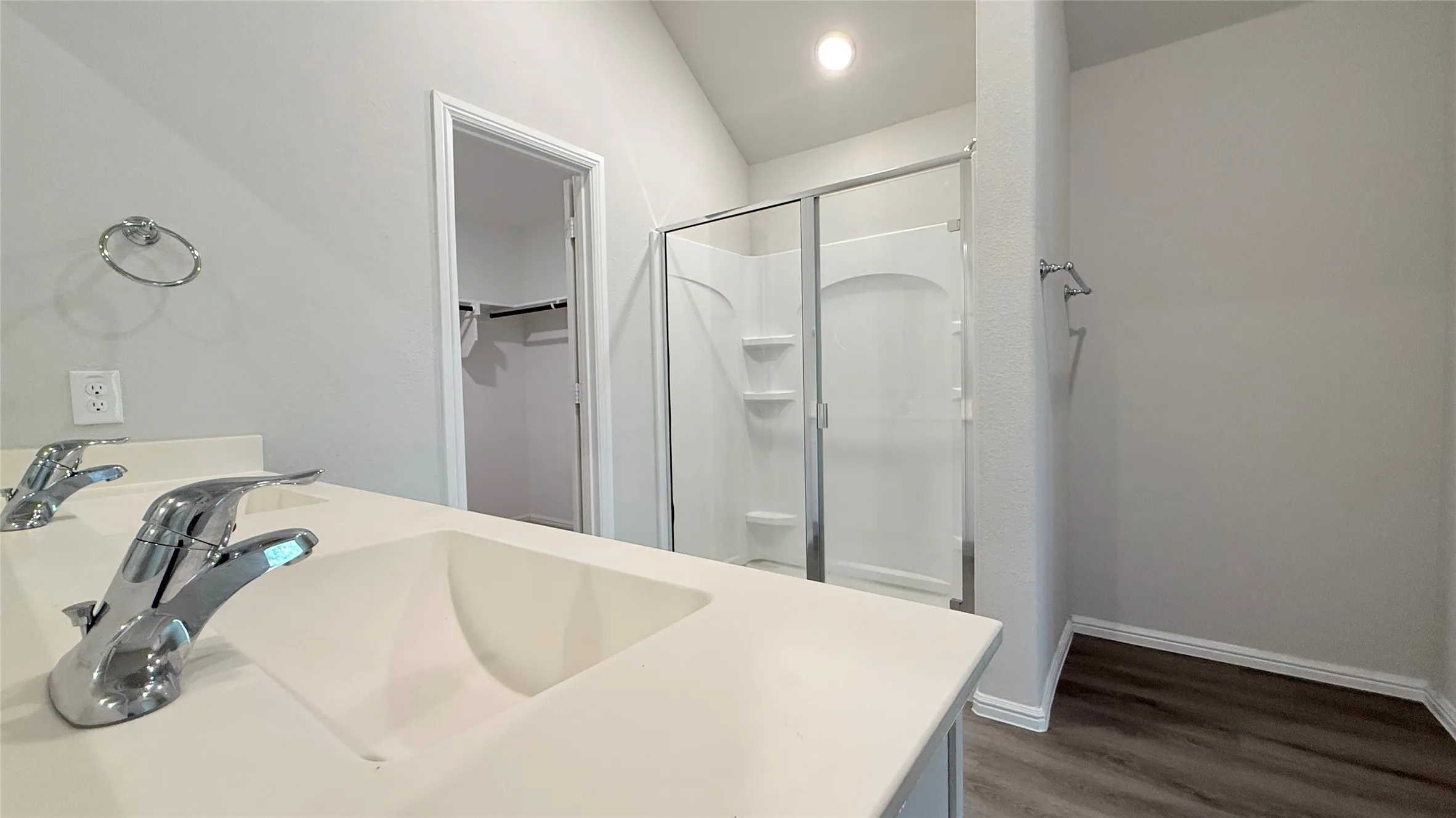 Dual vanity with integrated sinks and chrome fixtures
