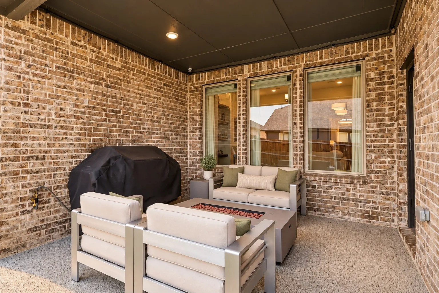 Covered Back Patio with epoxy coating, gas stub, permanent Jellyfish perimeter lighting.