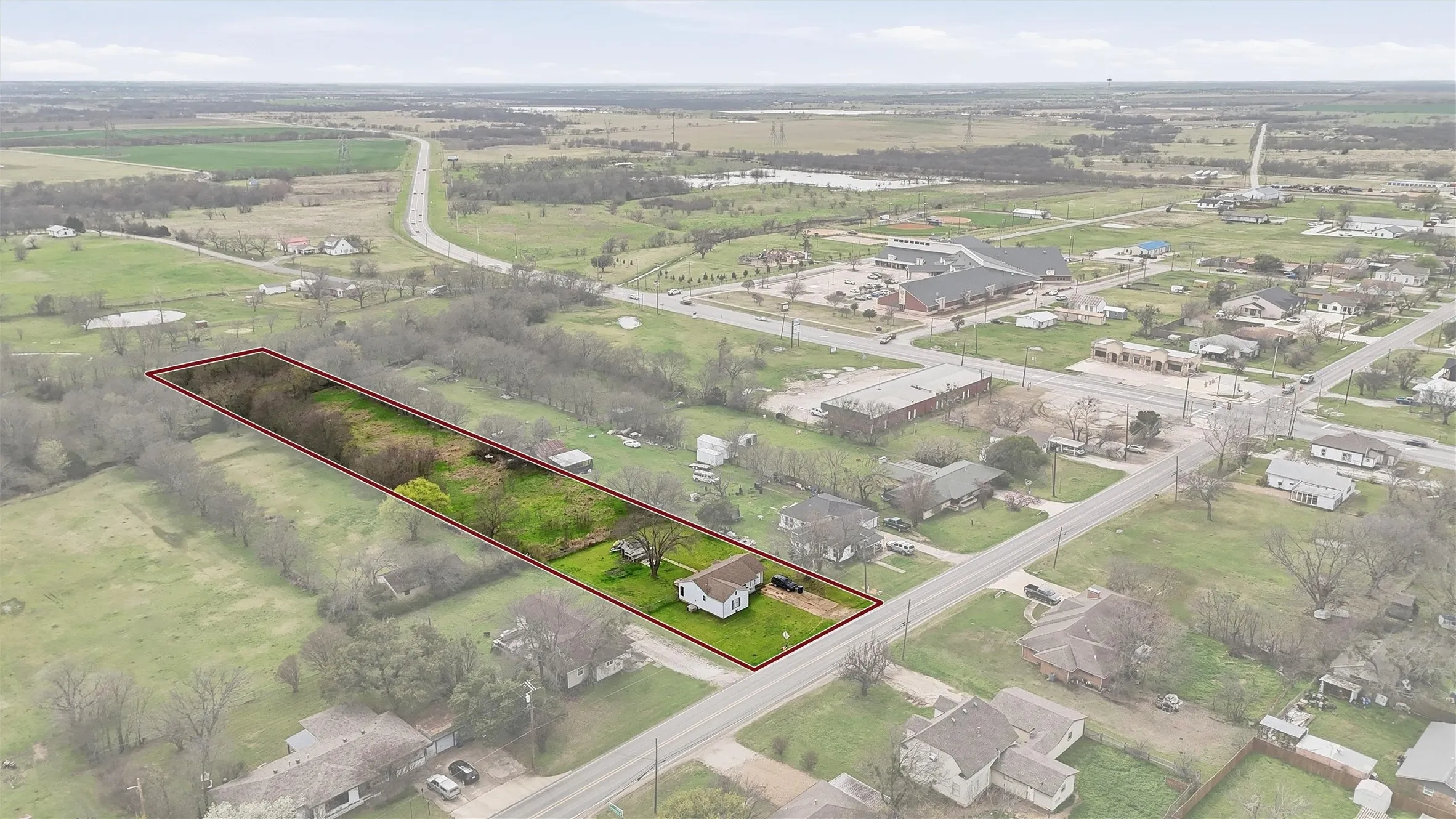Expansive lot with a single-story residence and mature trees