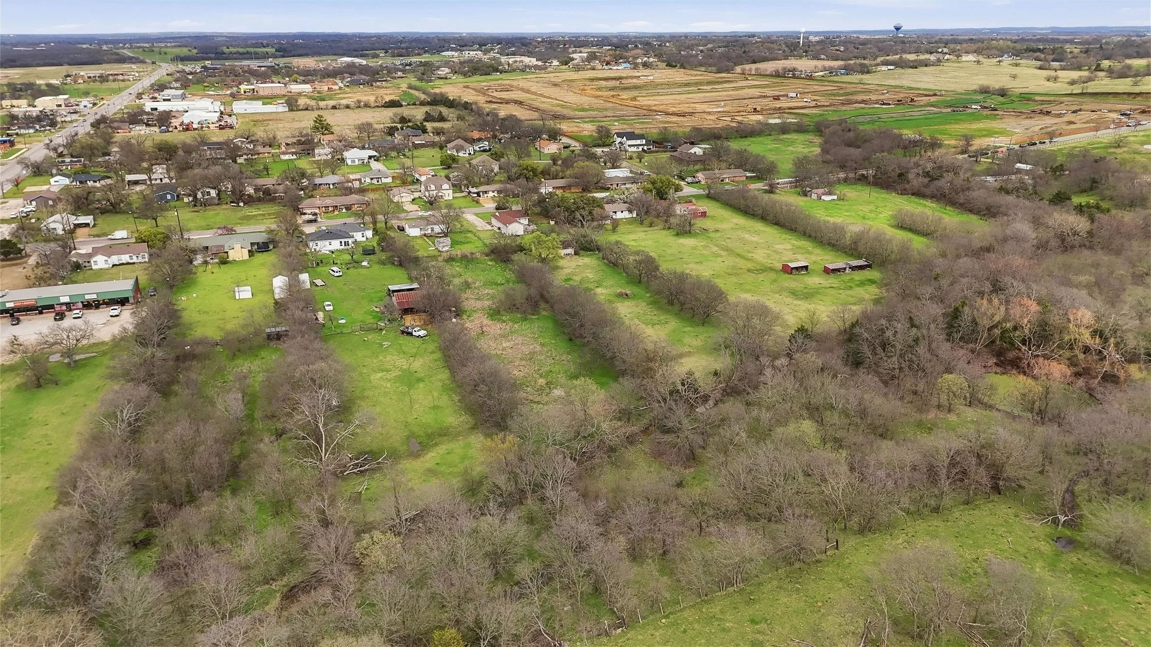 Expansive green spaces with surrounding residential and commercial structures