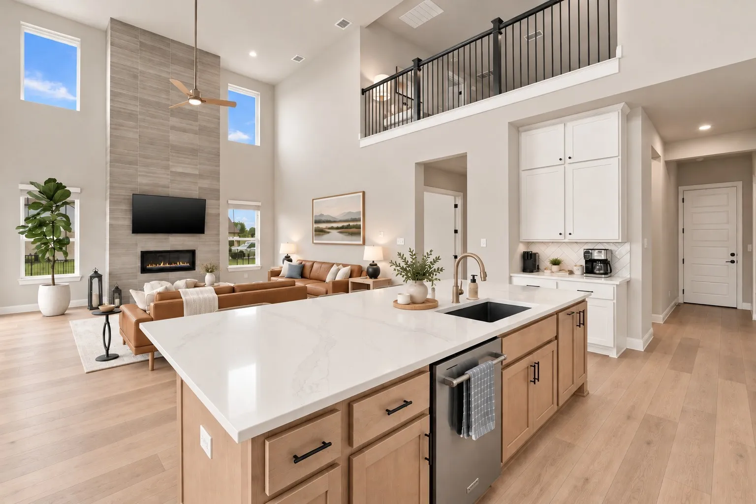 Two-story living area with a floor-to-ceiling tile fireplace