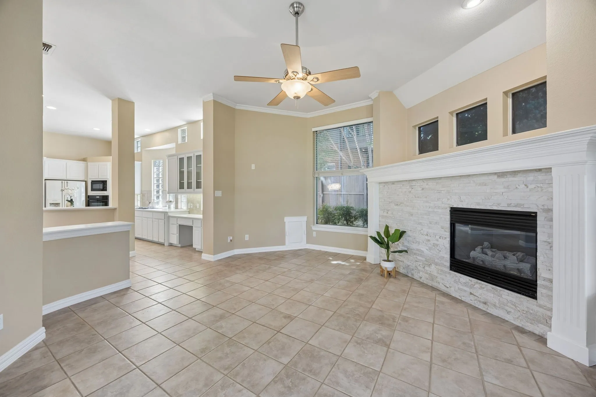 This view shows the flow between the family room, kitchen and casual dining space - perfect for relaxing at home! Yes that is a doggie door! Keep looking to see the adorable entrance from the backyard!