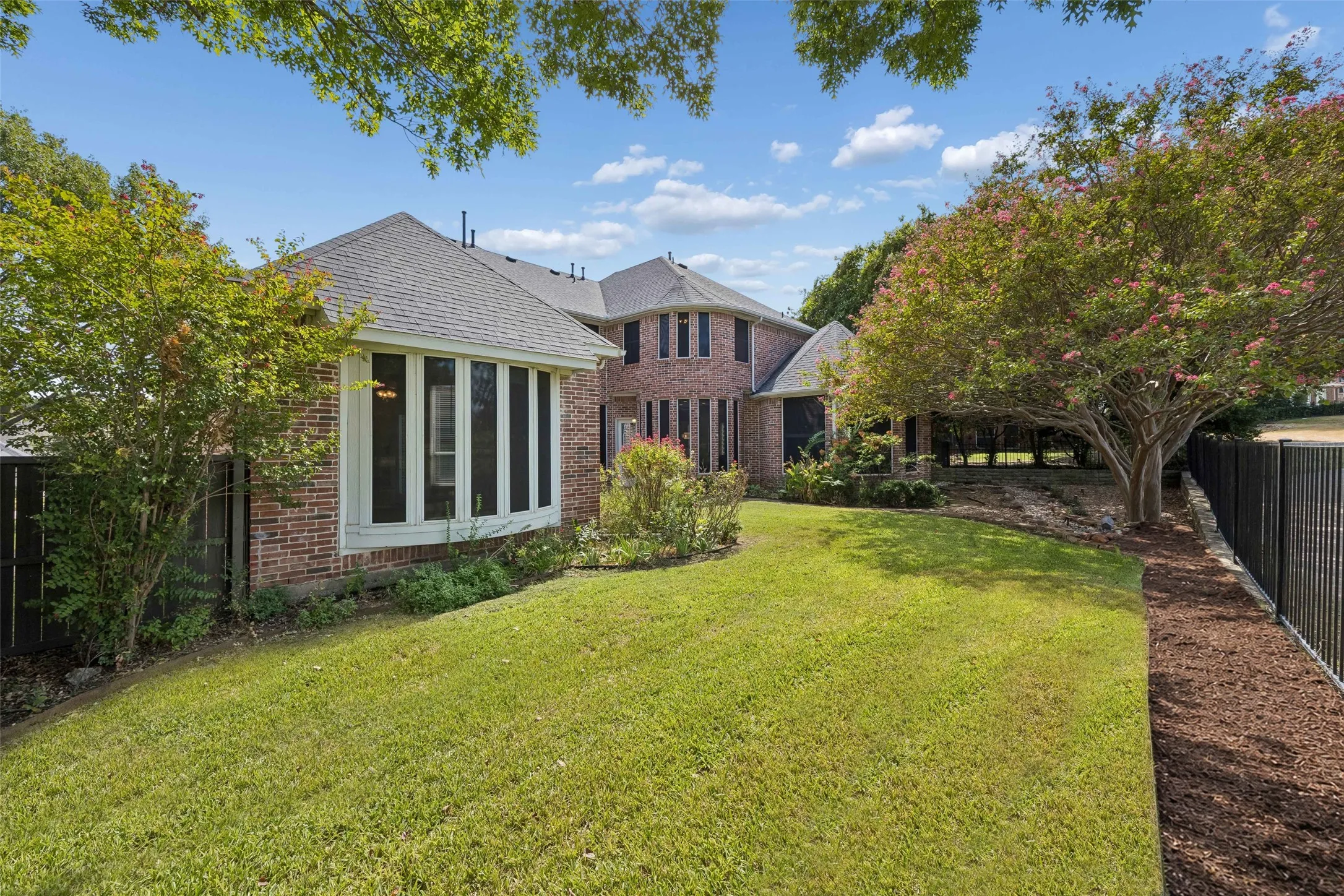Looking across the yard to the back of the home.