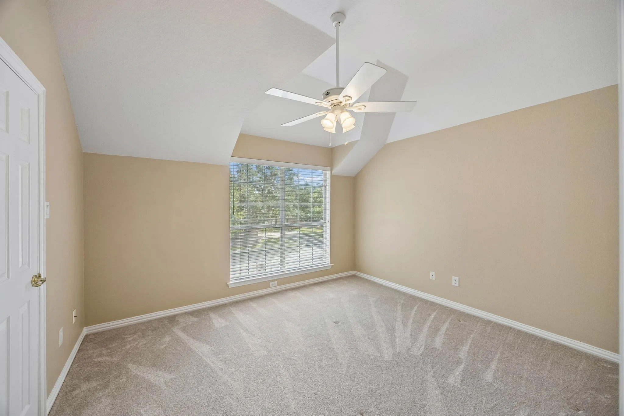 Found just off the game room, the second primary offers good storage with walk-in closet, linen closet, additional shelved storage closet and an en suite bathroom. Features also include carpet and ceiling fan.