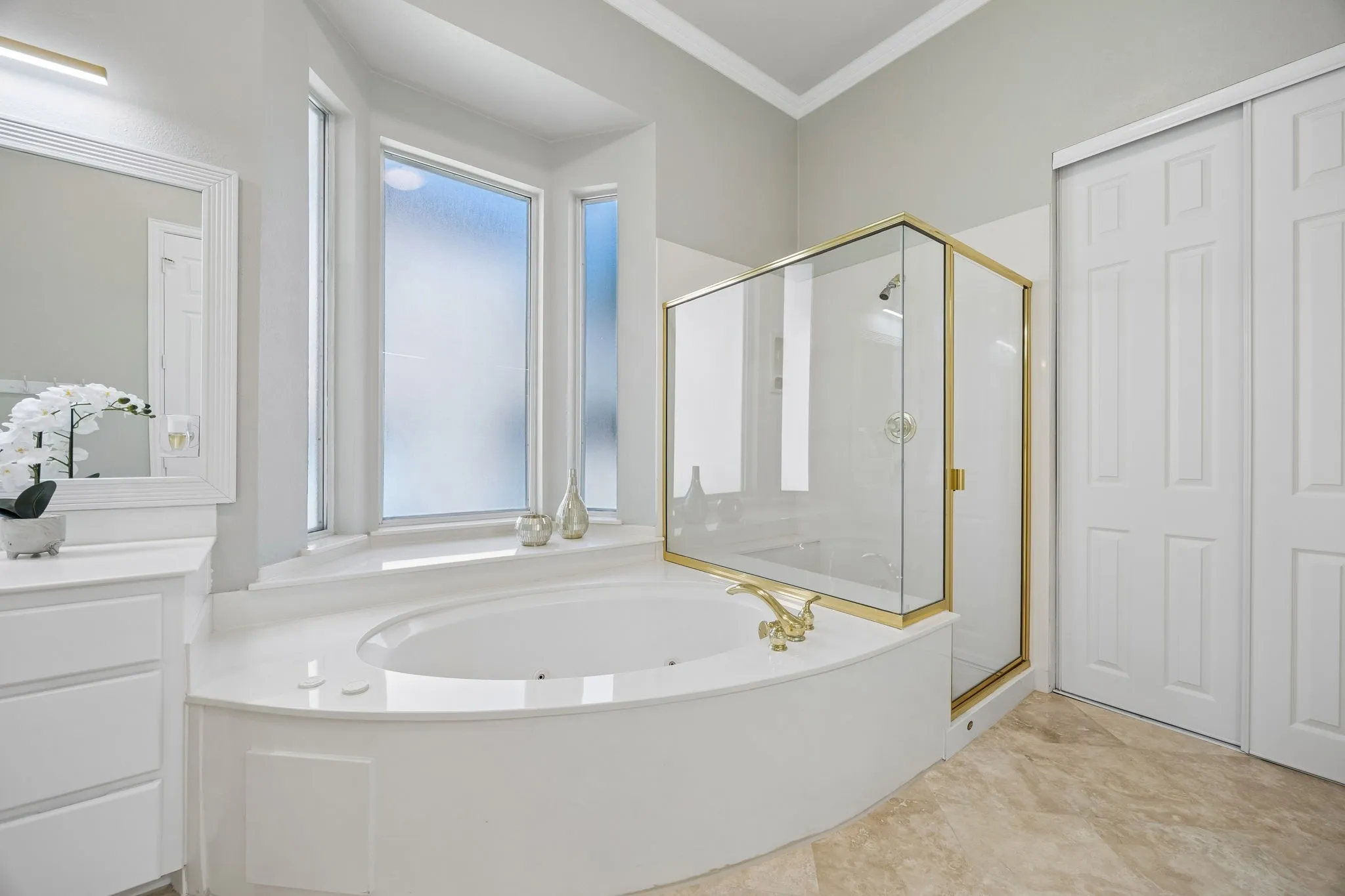 This spa-like bath offers relaxing oversized tub, separate shower and great natural light.
