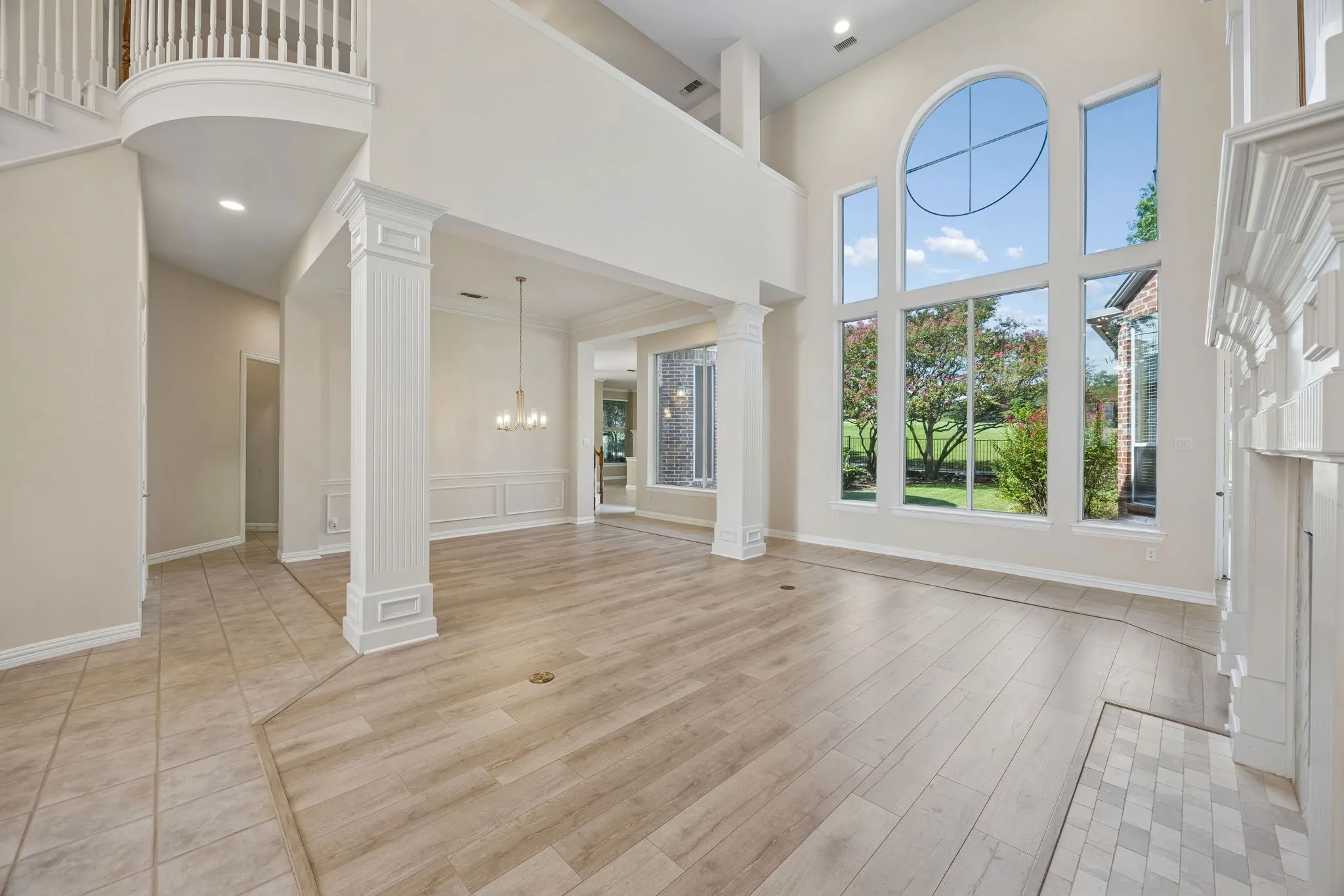 The space in the background is the formal dining room. The pillars provide a sense of separation. The opening to the left leads to the butler's pantry - so convenient when entertaining.