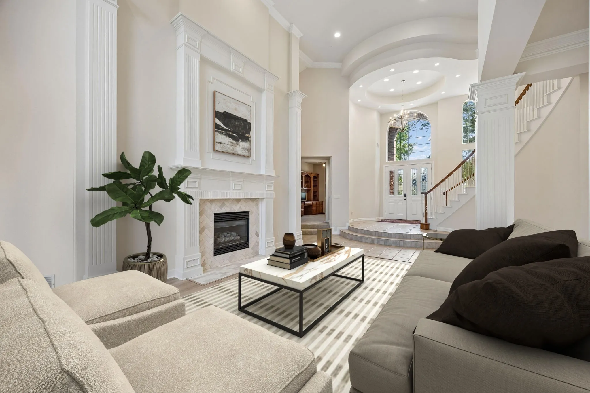 This view of the living room looks toward the entry and shows the flow of the space. Notice the entrance to the study in the background. (Virtually staged to show potential.)