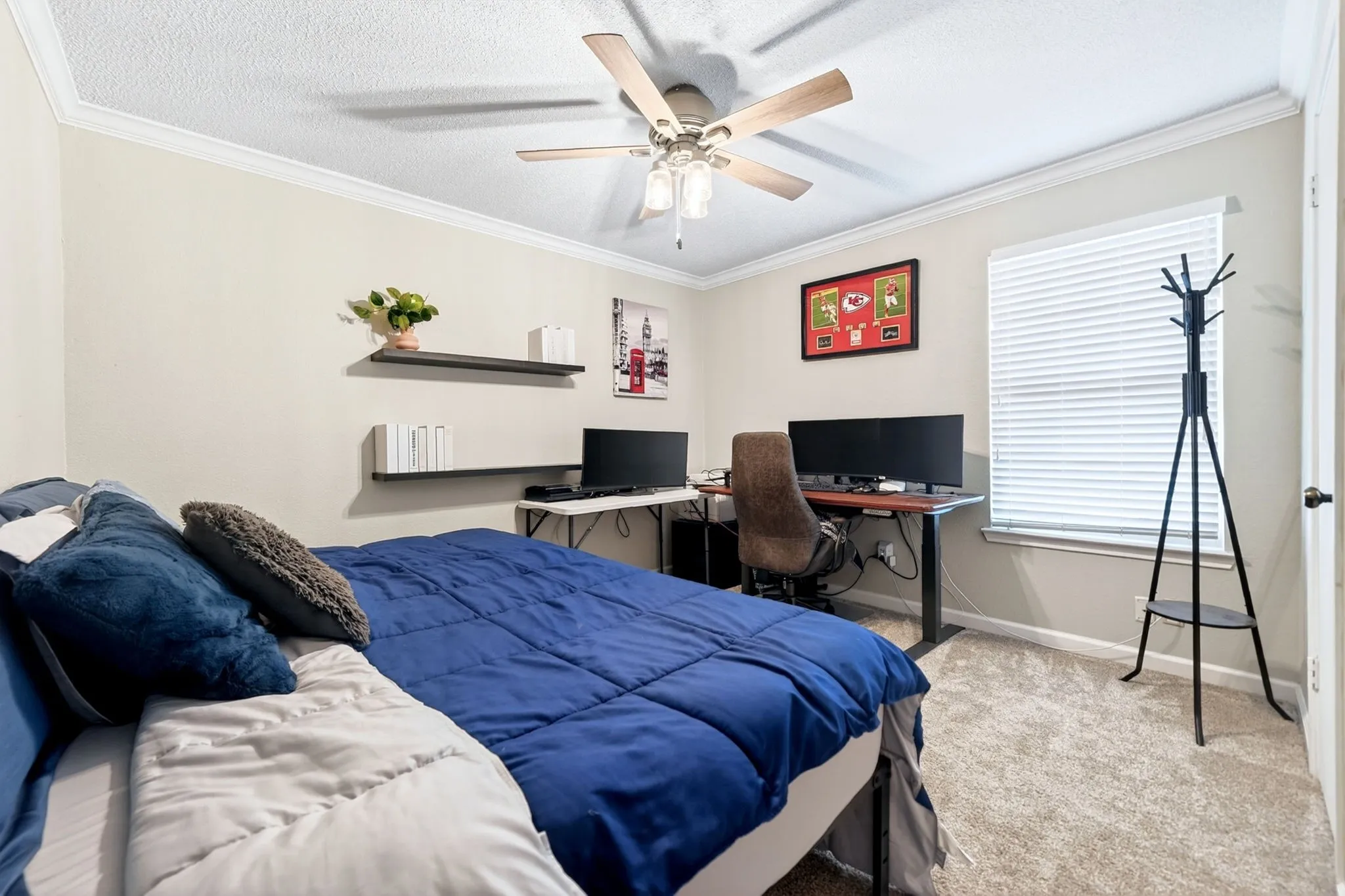 Recessed lighting, crown molding, ceiling fan, carpeted flooring, and a window with blinds