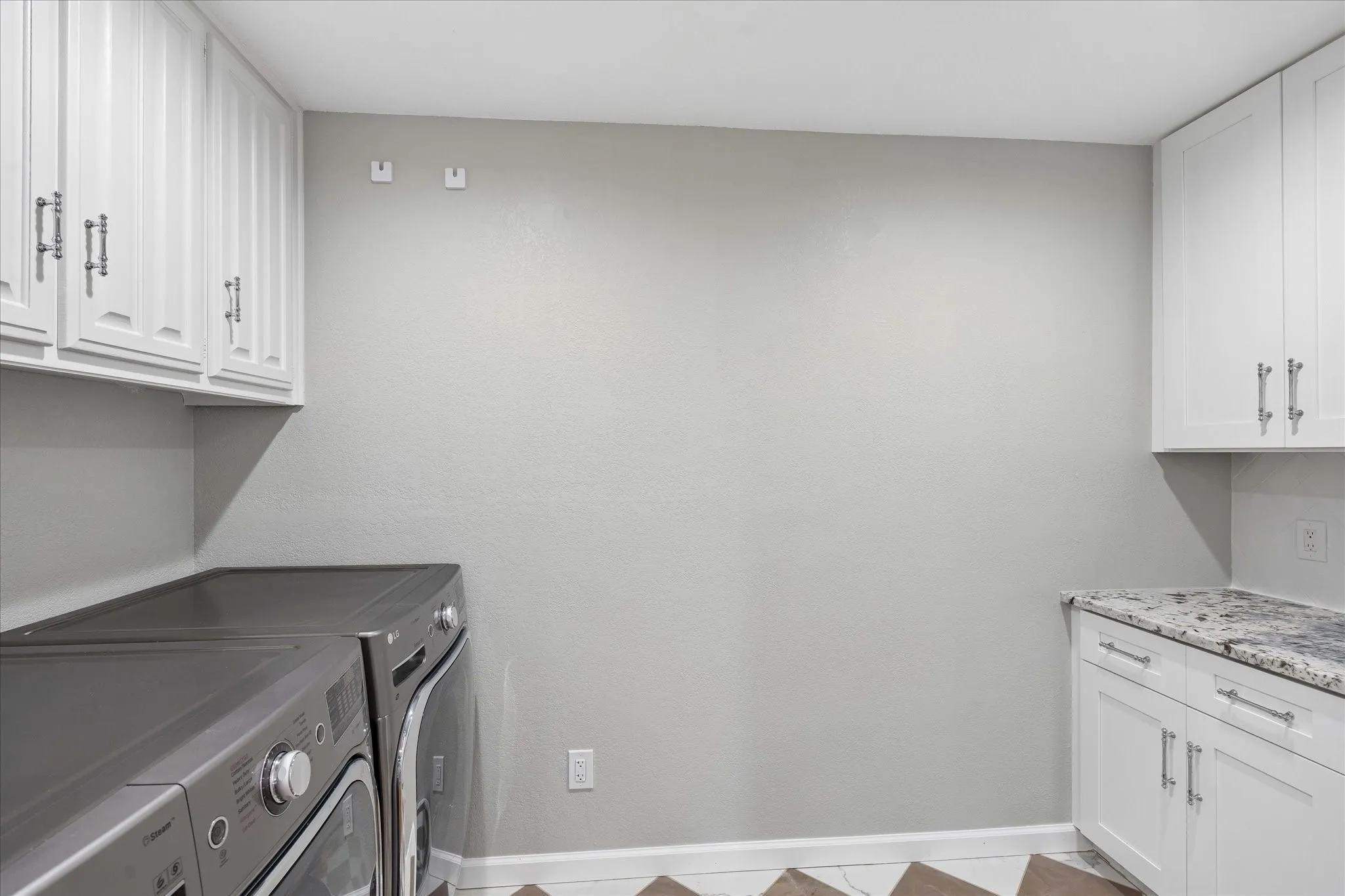 Laundry located right off the kitchen area