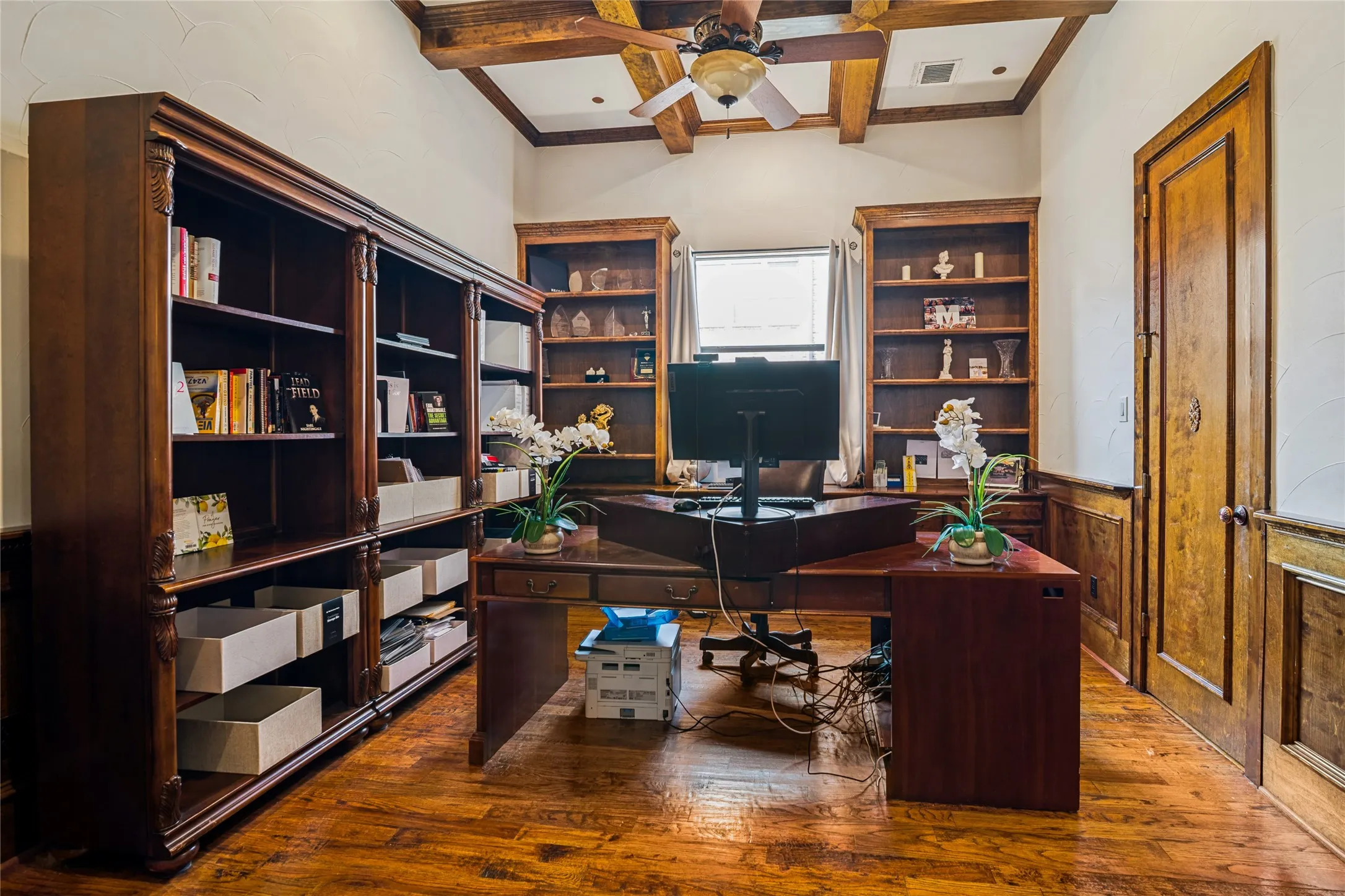 Wood-finish flooring with coffered ceiling and exposed wood beams