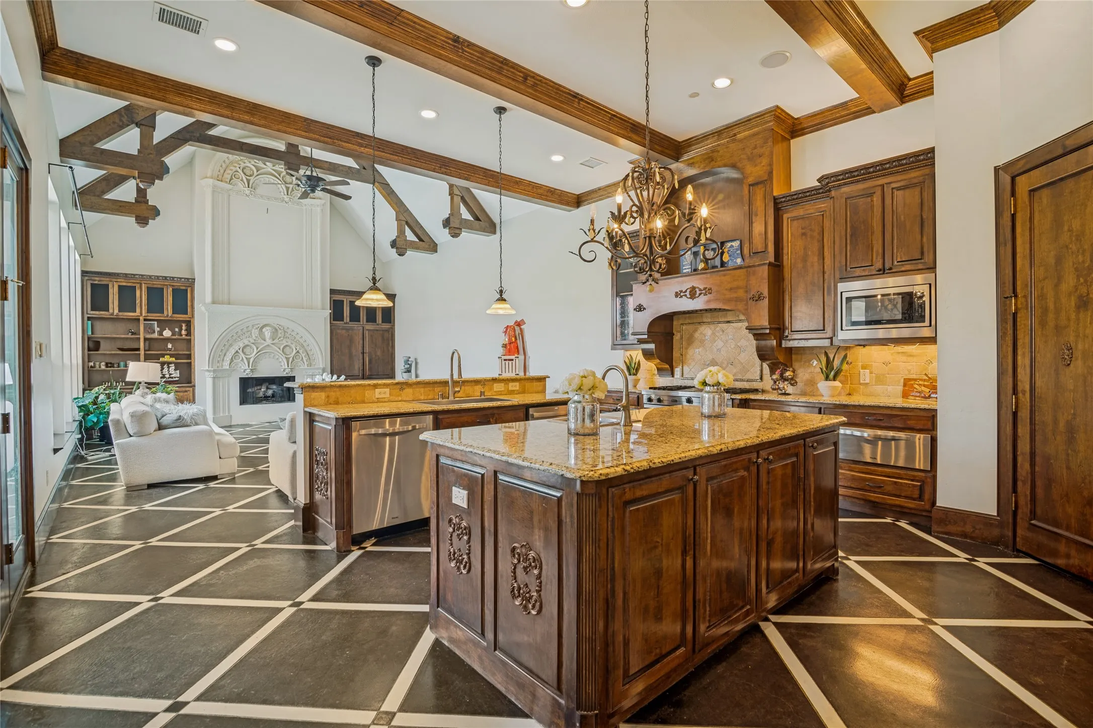 Kitchen featuring wood cabinetry, granite countertops, stainless steel appliances, and a central island