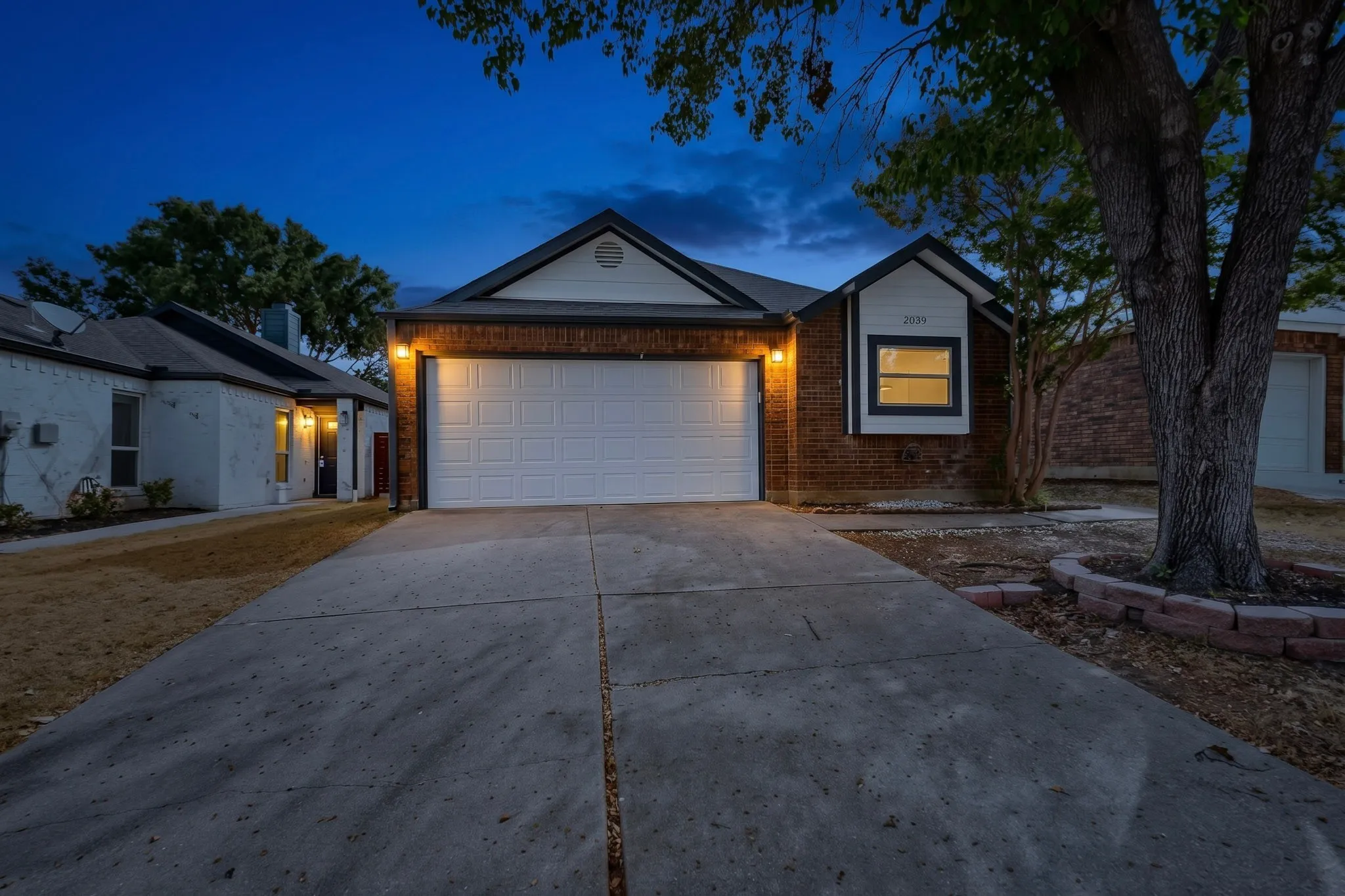 Brick exterior with white siding accents