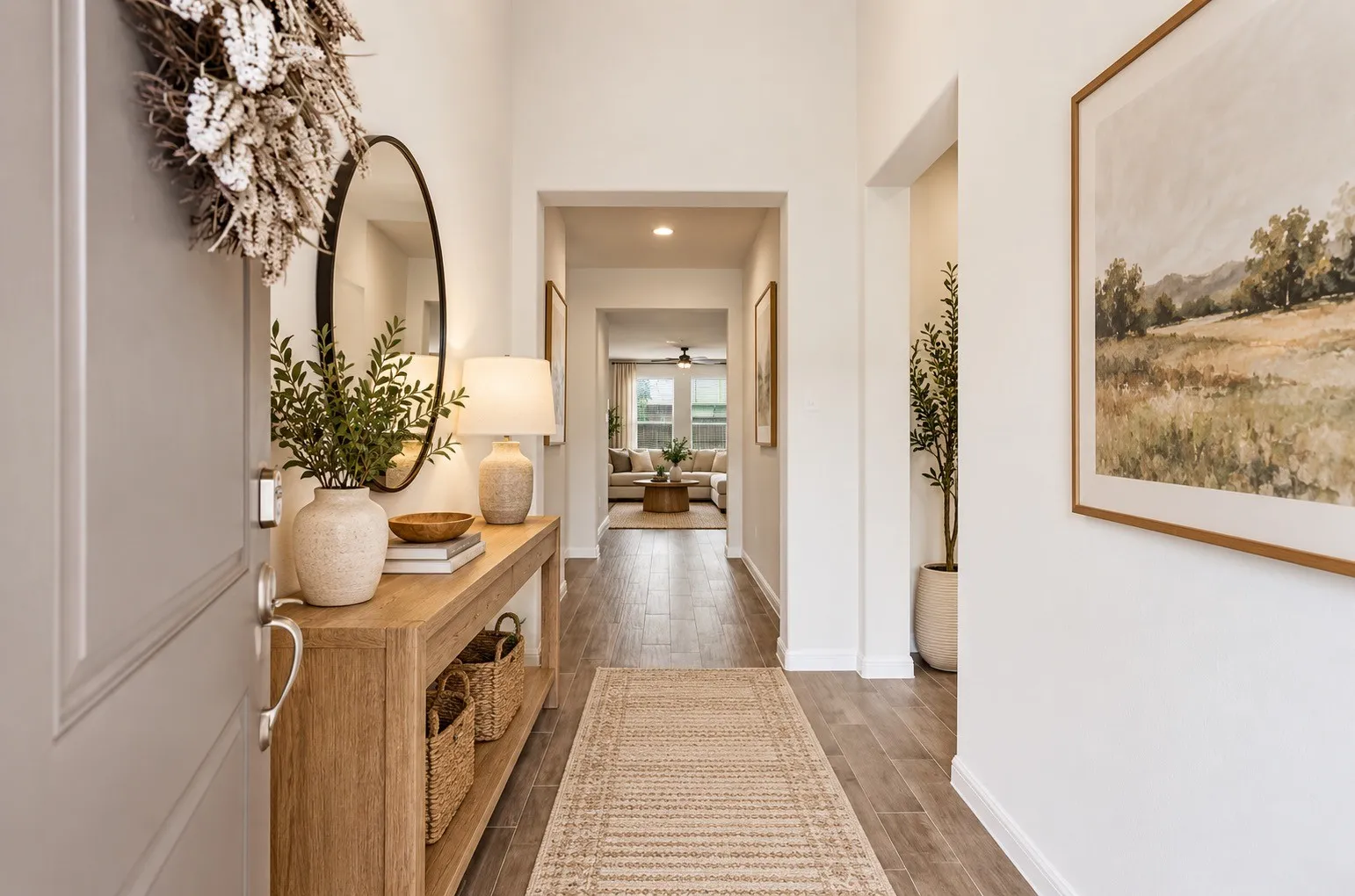 Entryway virtually staged. featuring wood-finish flooring, white wall finishes, and recessed lighting