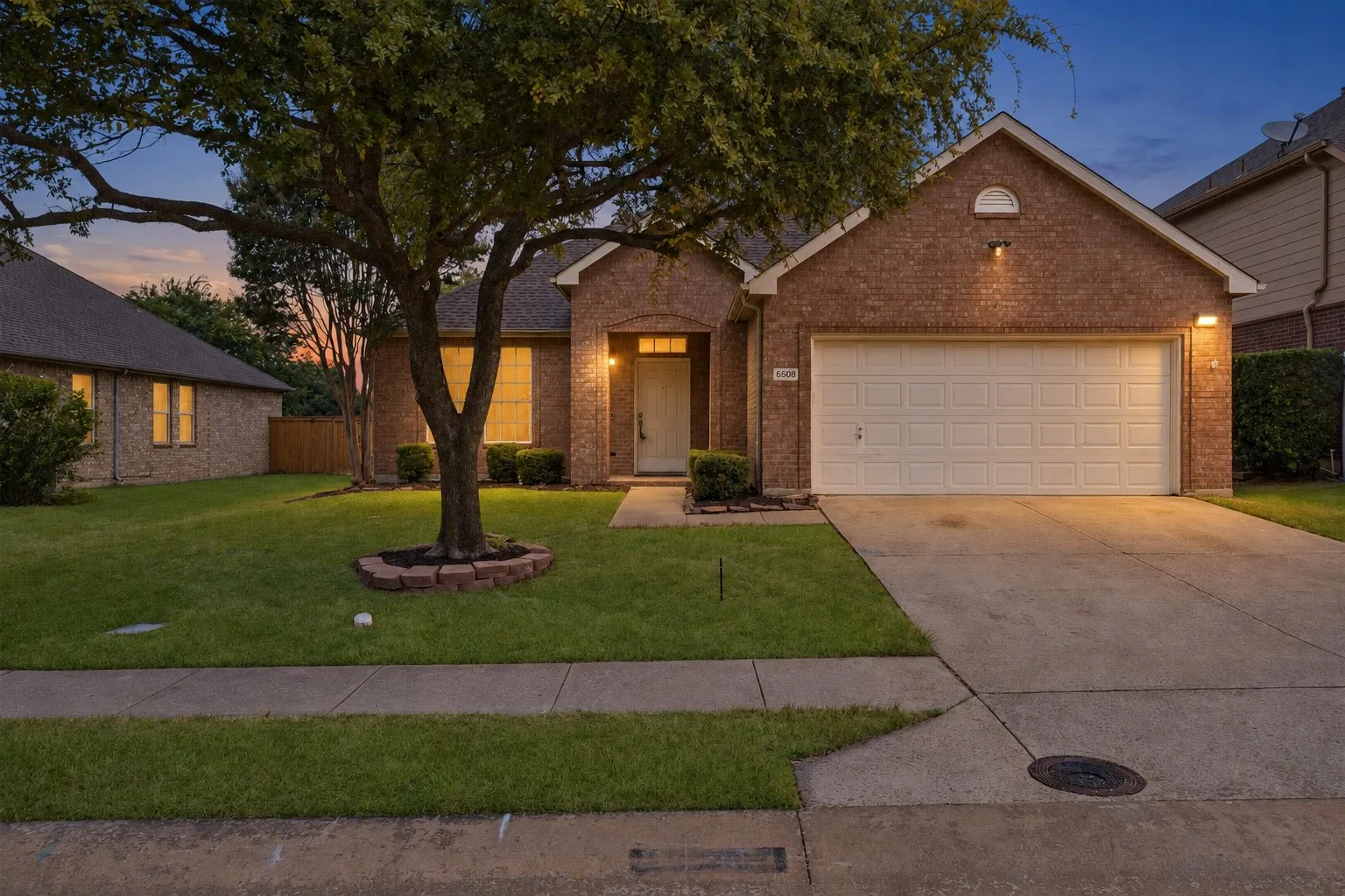 Brick exterior with attached two-car garage
