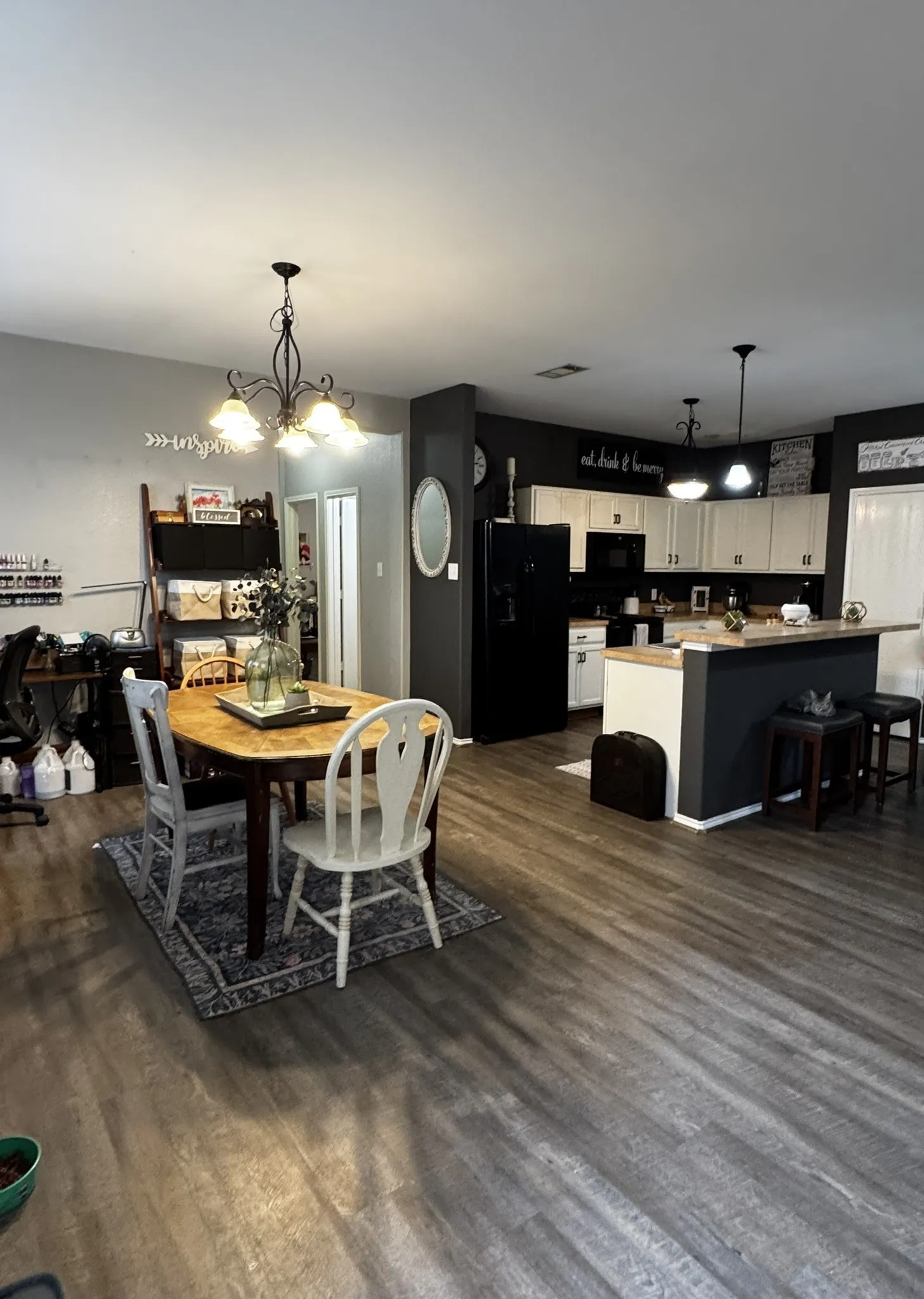 Open-concept living area with wood-finish flooring throughout