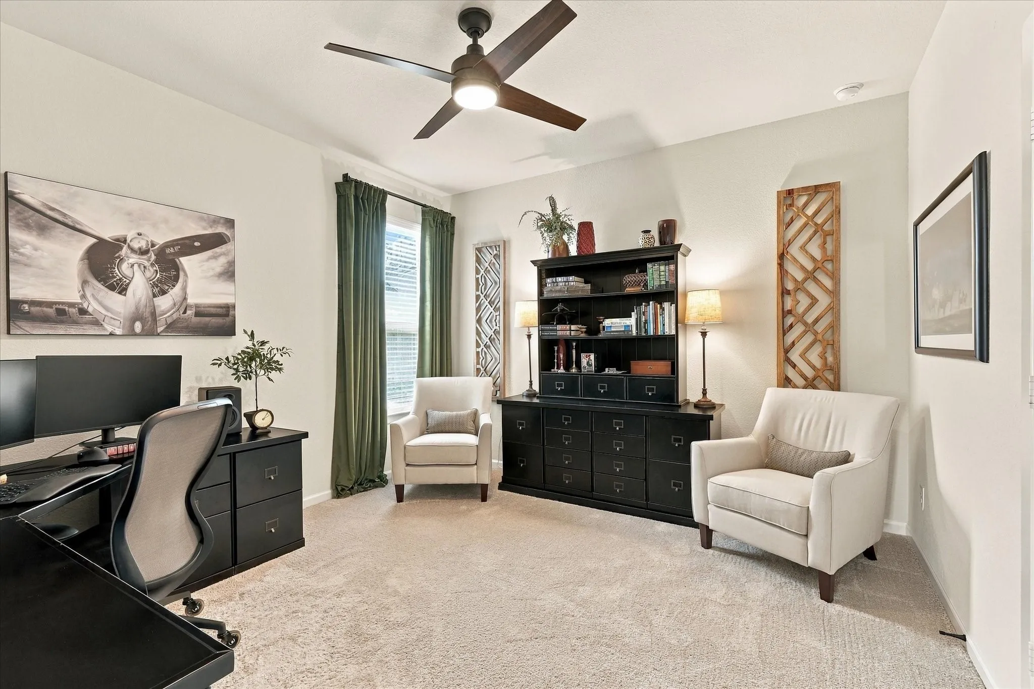 Gorgeous secondary bedroom with custom drapes and a walk-in closet.