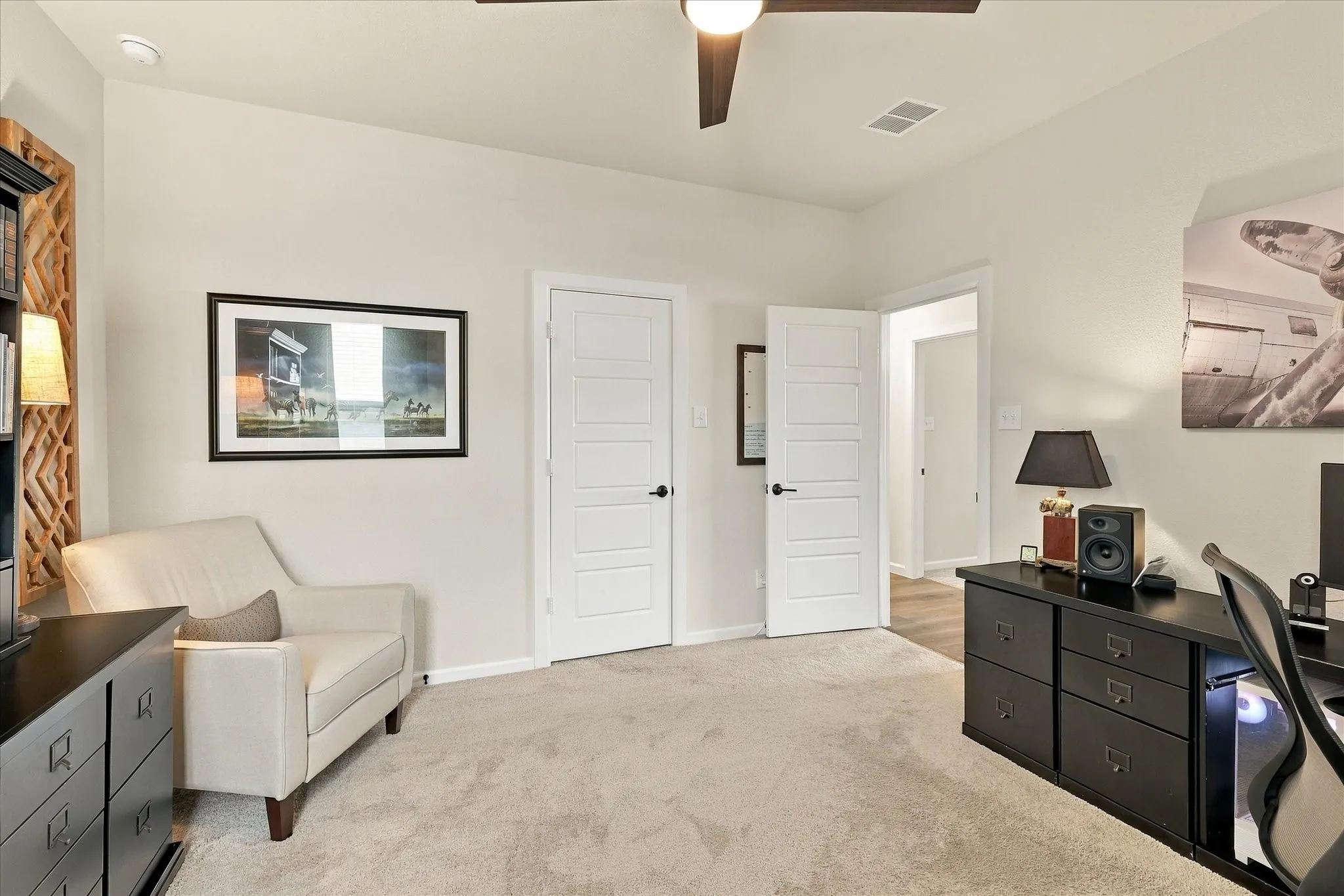 A spacious bedroom or secondary office offers the perfect work-from-home setup, with abundant natural light, generous wall space and room to create a truly executive workspace.