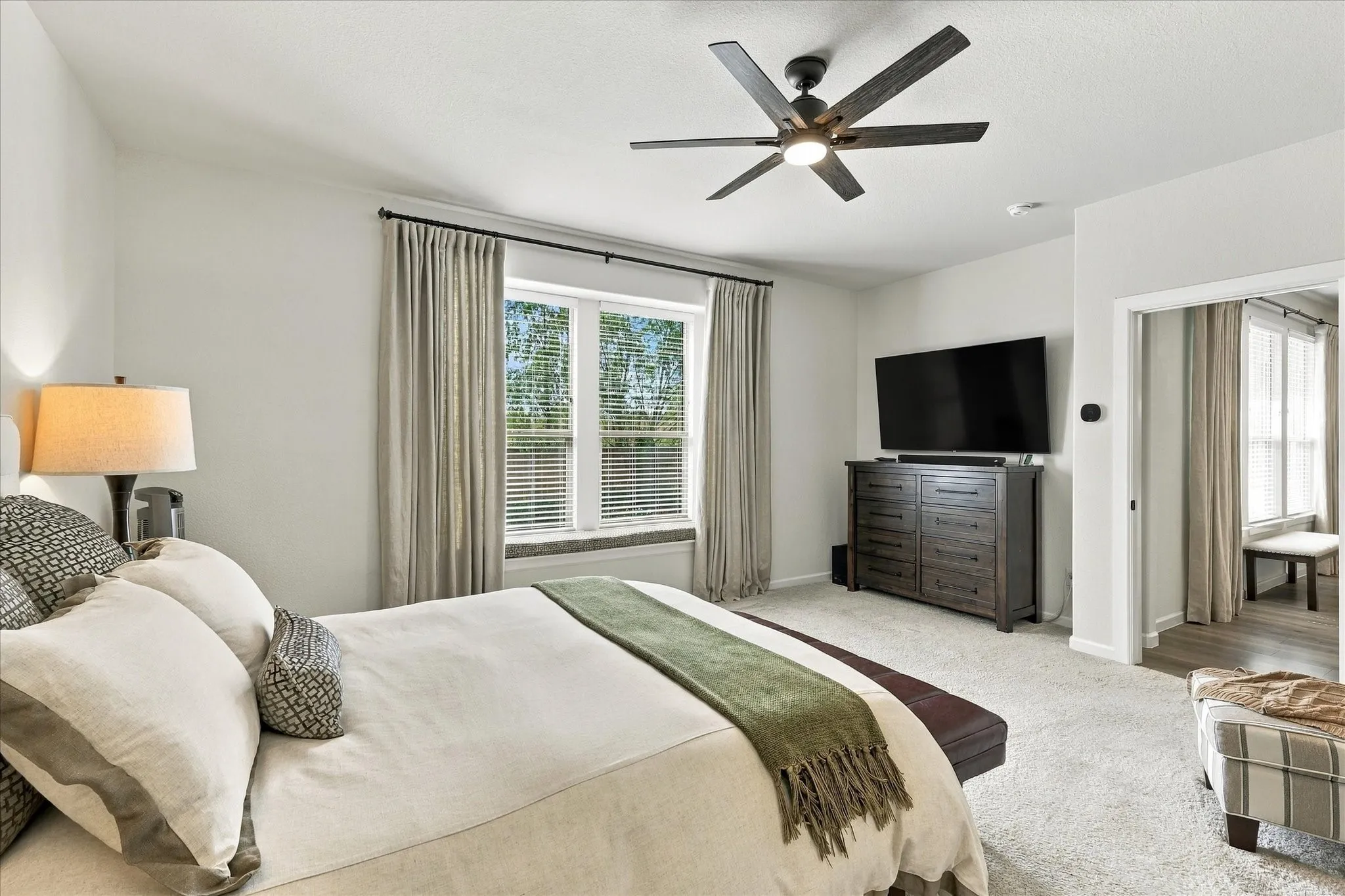 Spacious, serene and beautifully proportioned, the primary bedroom offers a peaceful escape with soft neutral finishes and abundant natural light.