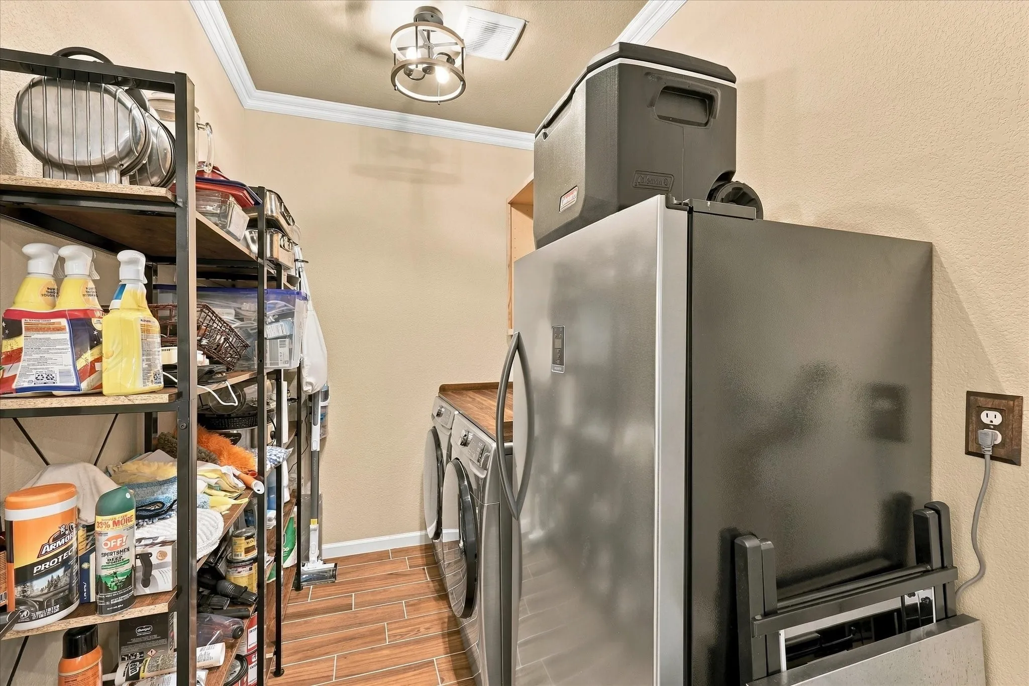 A dedicated laundry and utility space adds valuable everyday functionality, with room for additional storage and household organization.