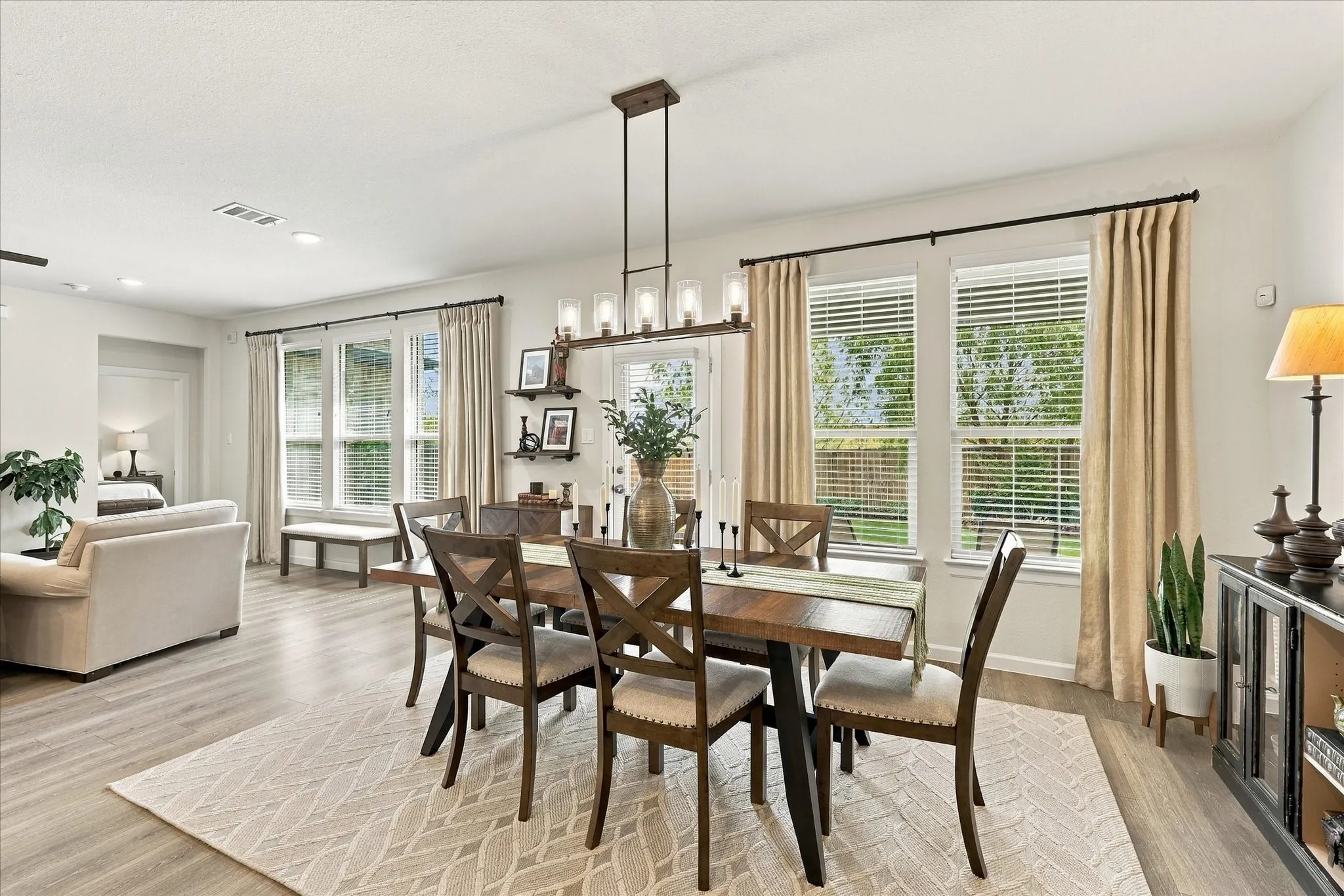Bright and inviting, the dining area offers plenty of room for gatherings and everyday meals, with direct backyard access and a seamless connection to the kitchen.