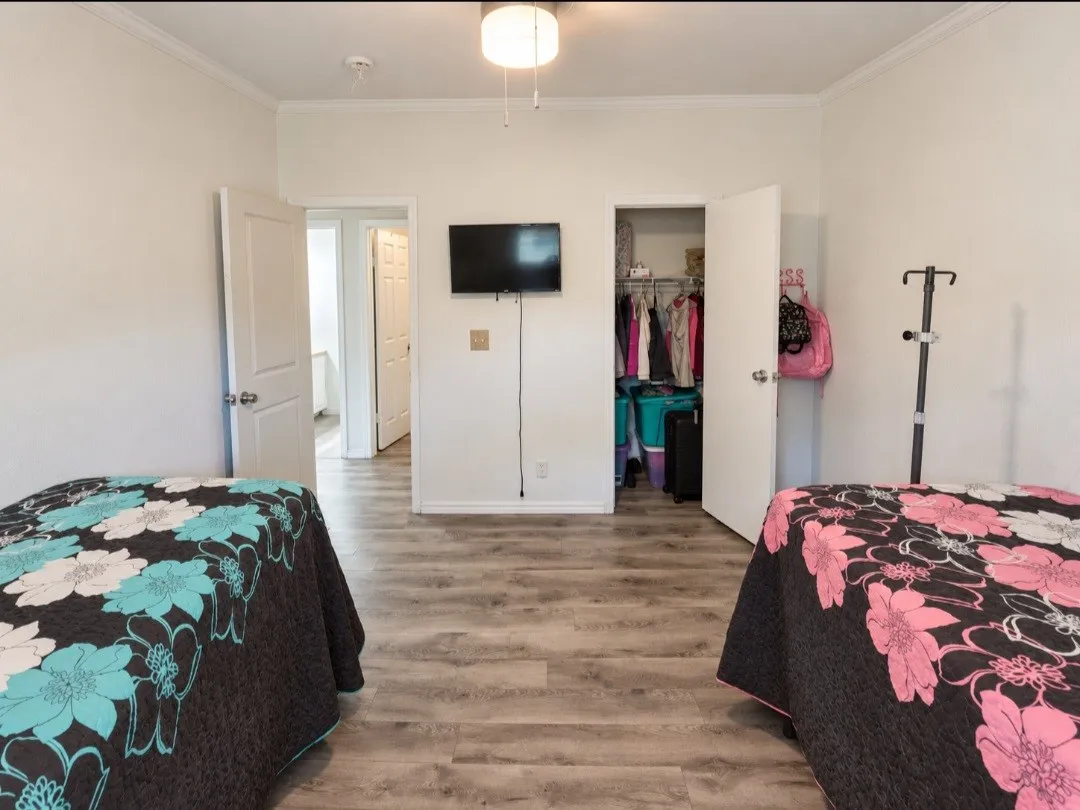  bright white walls, and a ceiling fan with light fixture
