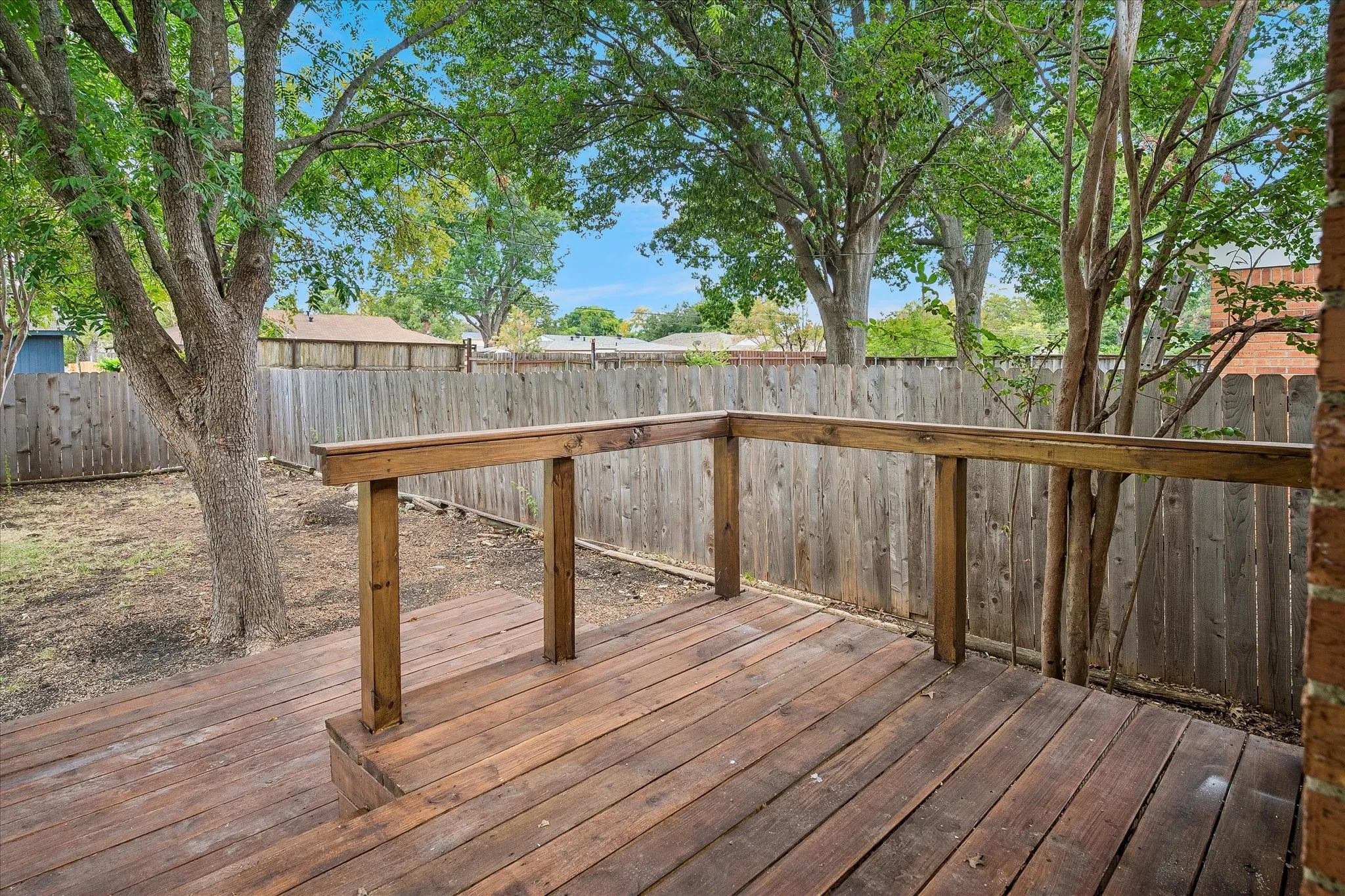 Wonderful shade trees and privacy fence.