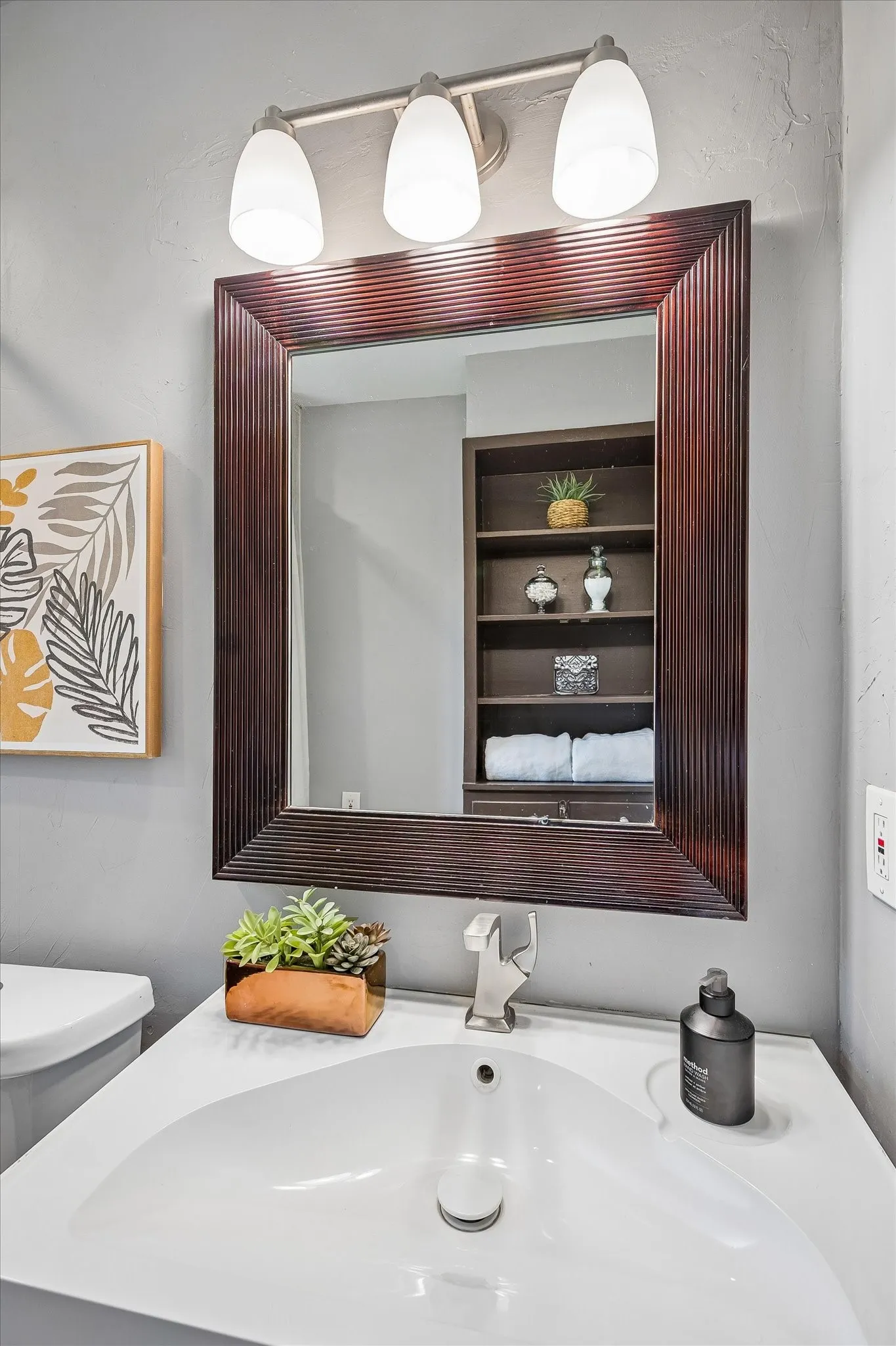 Nice vanity with large sink and custom built-ins behind.