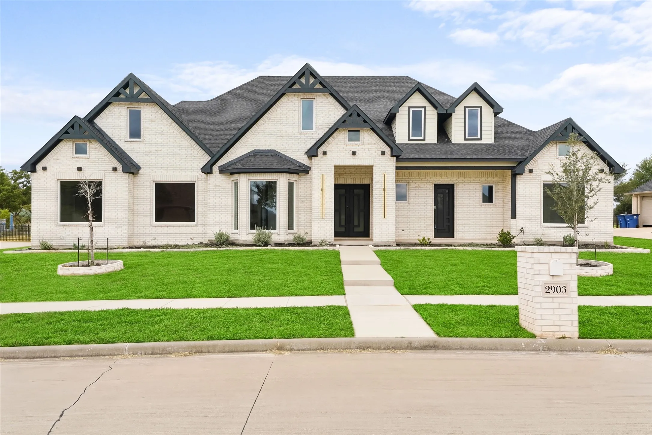 White brick exterior with dark trim accents