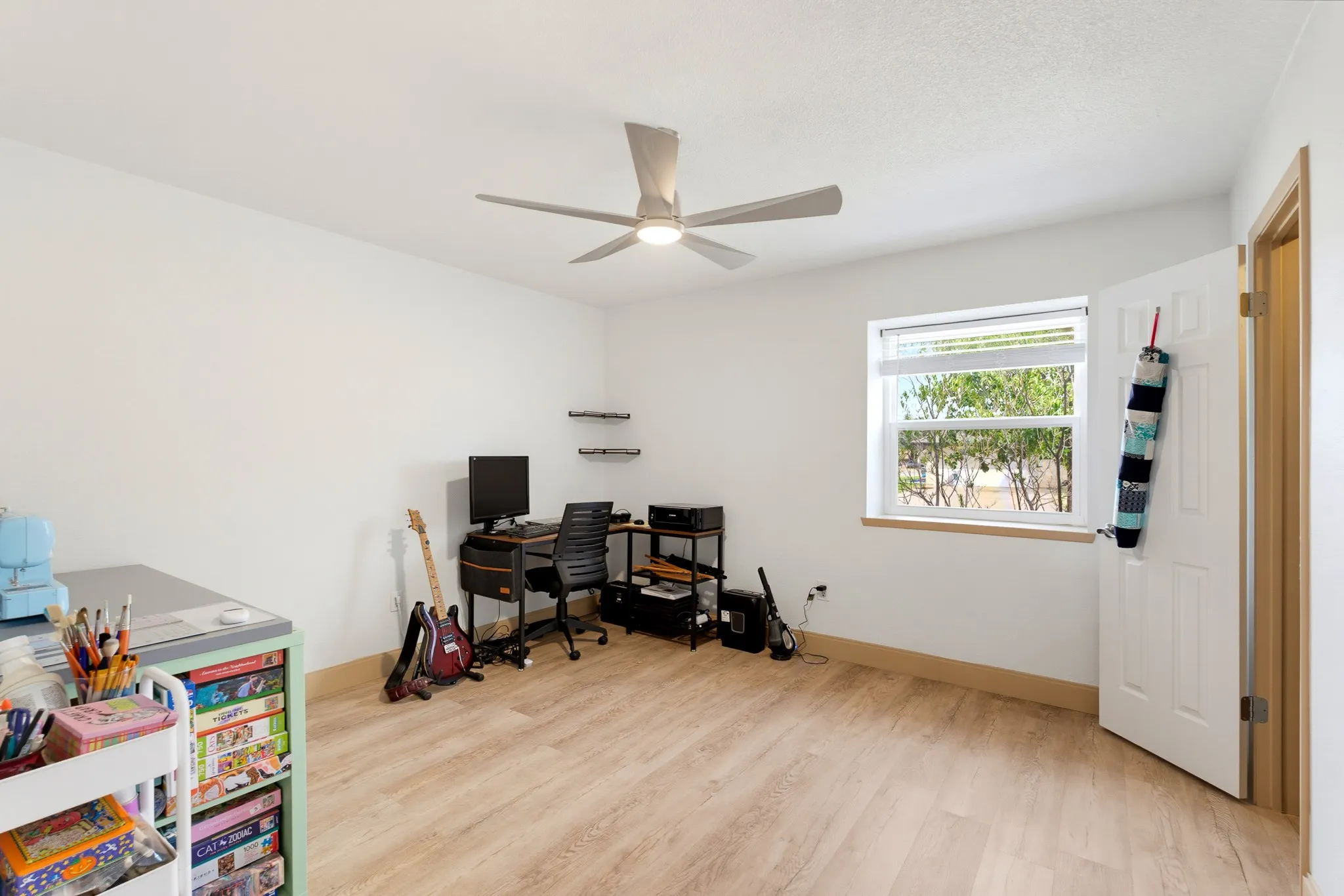 Neutral wall finishes with wood-finish flooring