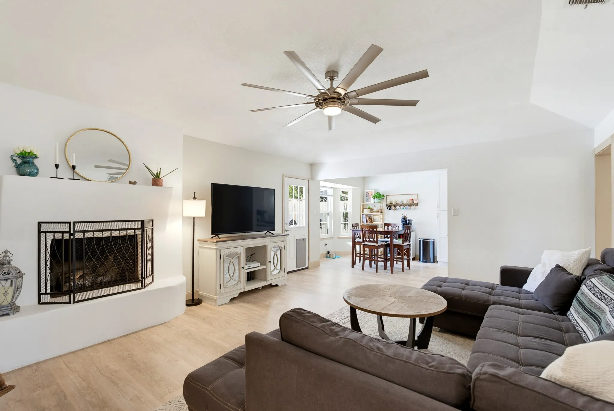 White-painted fireplace hearth with black metal screen