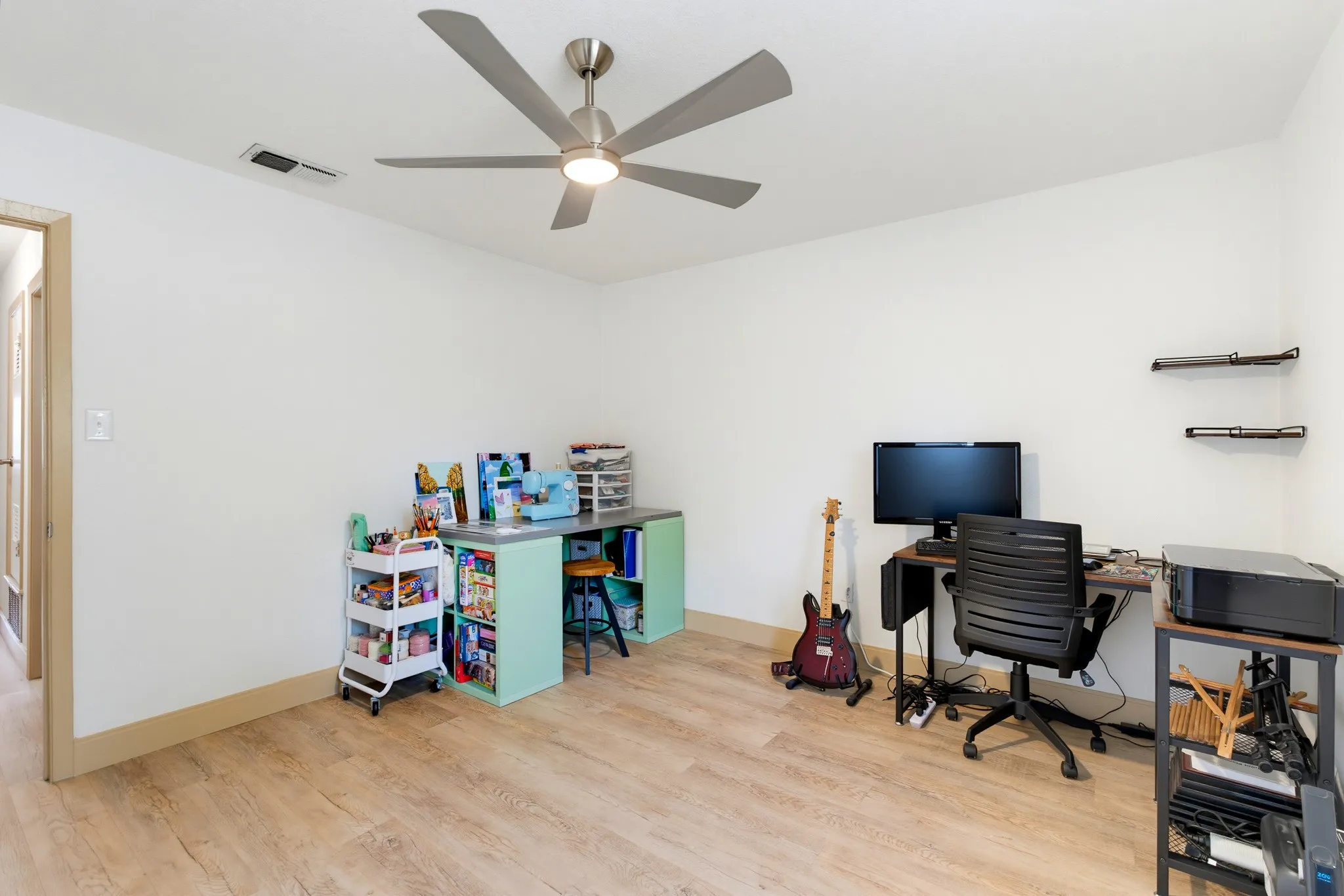 Wood-finish flooring with white wall finishes