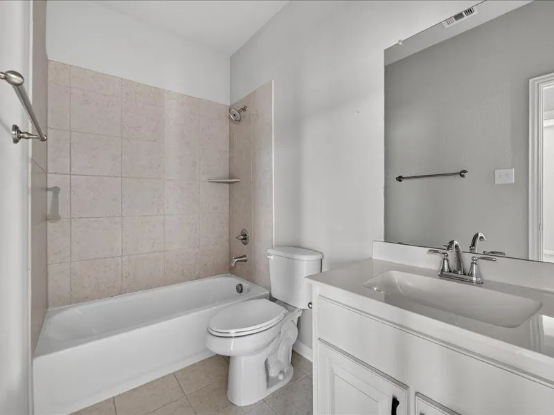White vanity with integrated rectangular sink and polished chrome faucet