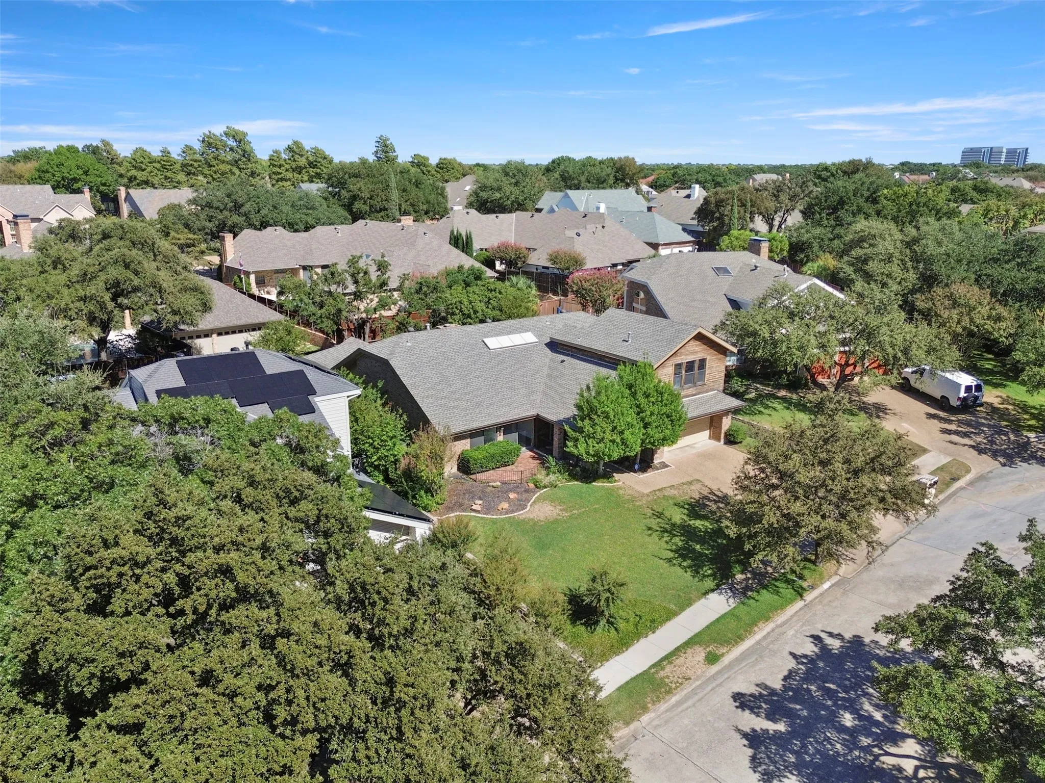 Residential property with a gabled roof and brick exterior accents